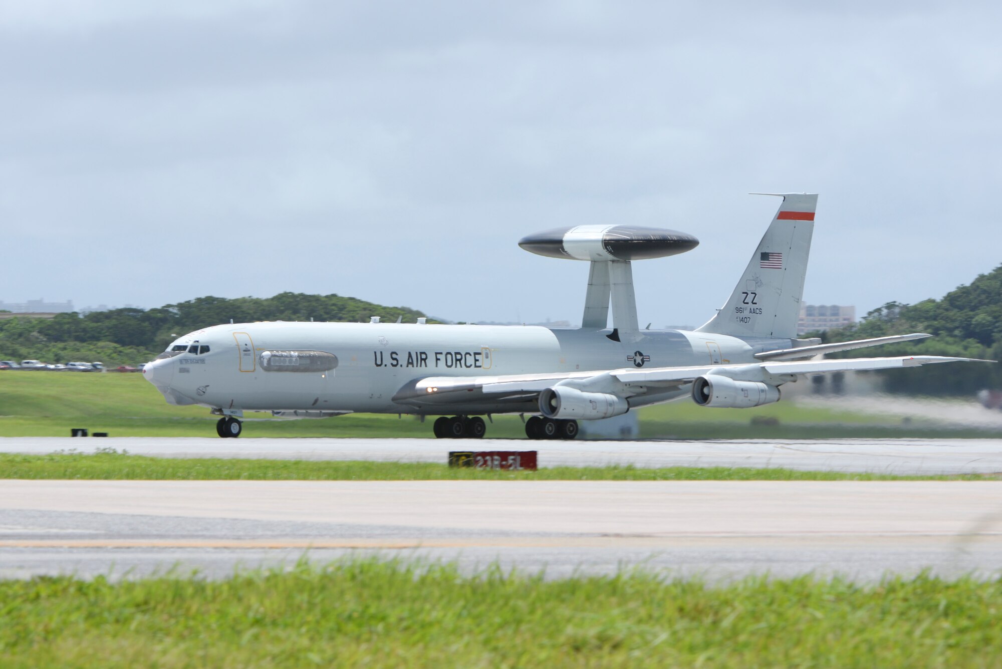 A U.S. Air Force E-3 Sentry Airborne Warning and Control System from the 961st Airborne Air Control Squadron taxis on the runway before takeoff from Kadena Air Base, Japan, to avoid damaging winds and debris from an approaching typhoon Aug. 21, 2015. Each time a typhoon moves too close to Okinawa, units across Kadena follow a standardized procedure to ensure maximum safety and security for all equipment and assigned personnel during the strong winds and debris associated with the storms. If it remains on course and at its current speed, Typhoon Goni is expected to hit Okinawa within the next few days. (U.S. Air Force photo by Senior Airman Omari Bernard)