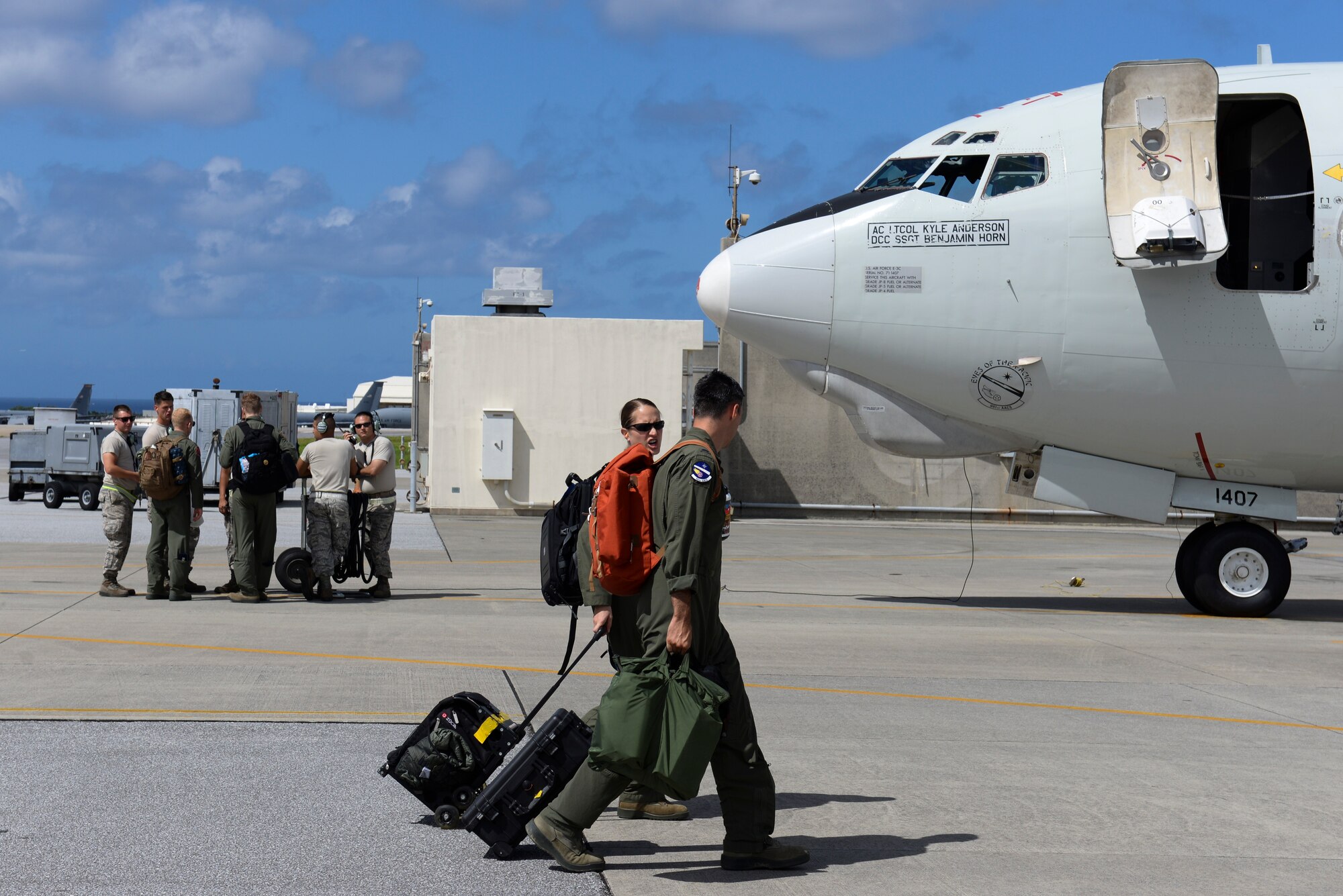 U.S. Air Force Airmen from the 961st Airborne Air Control Squadron prepare to board a U.S. Air Force E-3 Sentry Airborne Warning and Control System from the 961st AACS on Kadena Air Base, Japan, Aug. 21, 2015. Each time a typhoon moves too close to Okinawa, units across Kadena follow a standardized procedure to ensure maximum safety and security for all equipment and assigned personnel. If it remains on course and at its current speed, Typhoon Goni is expected to hit Okinawa within the next few days. (U.S. Air Force photo by Senior Airman Omari Bernard) 