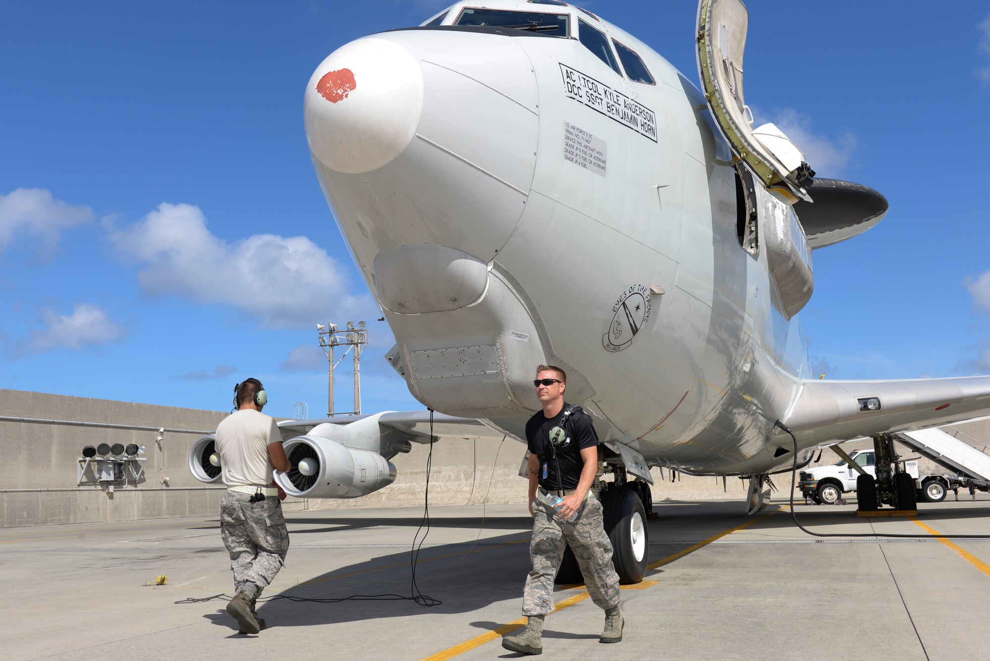 U.S. Air Force Airmen from the 961st Aircraft Maintenance Unit perform pre-flight inspections on a U.S. Air Force E-3 Sentry Airborne Warning and Control System from the 961st Airborne Air Control Squadron on Kadena Air Base, Japan, Aug. 21, 2015. In standard preparation of typhoons like Typhoon Goni, which is slated to possibly strike this weekend, numerous flying squadrons on the base relocate their aircraft to other bases in the region to protect them from the damaging winds and debris associated with the storm. (U.S. Air Force photo by Senior Airman Omari Bernard)