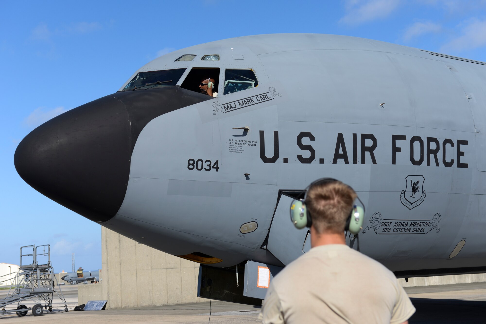U.S. Air Force Airman Nathan Heisterman, 909th 17th Aircraft Maintenance Squadron aerospace propulsion apprentice looks on as Tech. Sgt. David Williams, 909th 17th Aircraft Maintenance Squadron aerospace propulsion craftsman, checks the engines of a KC-135 Stratotanker on Kadena Air Base, Japan, Aug. 21, 2015. In preparation for natural disasters, numerous flying squadrons on the base relocate their aircraft to other bases in the region to protect them from possible damage. (U.S. Air Force photo by Senior Airman Omari Bernard)