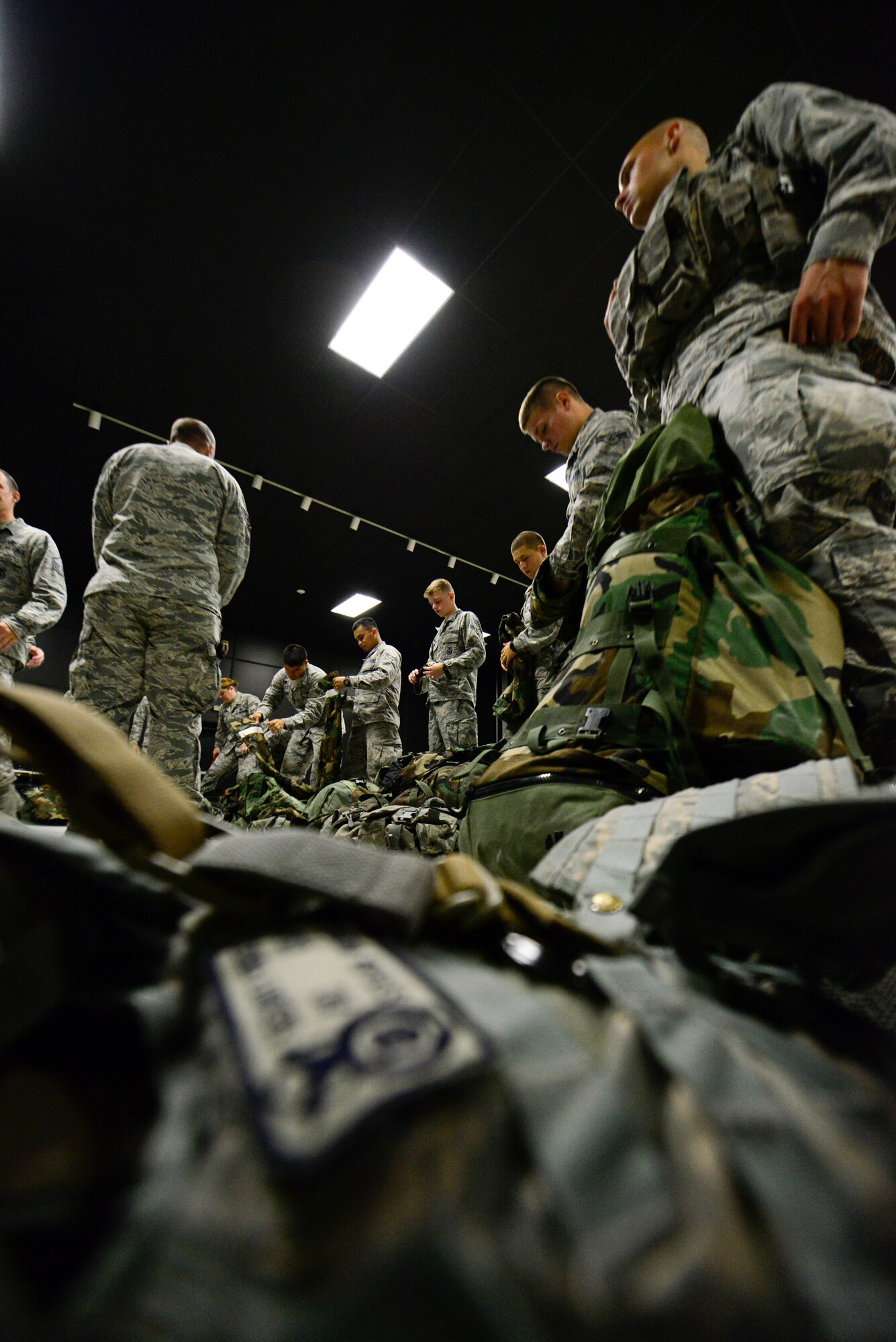 Defenders from the 51st Security Forces Squadron wait in line for inspection on Osan Air Base, Republic of Korea, Aug. 18, 2015. In preparation for the readiness exercise, the defenders inspected their chemical warfare gear and conducted refresher training on various weapons that may be used in real-world wartime environments. (U.S. Air Force photo/Senior Airman Kristin High)