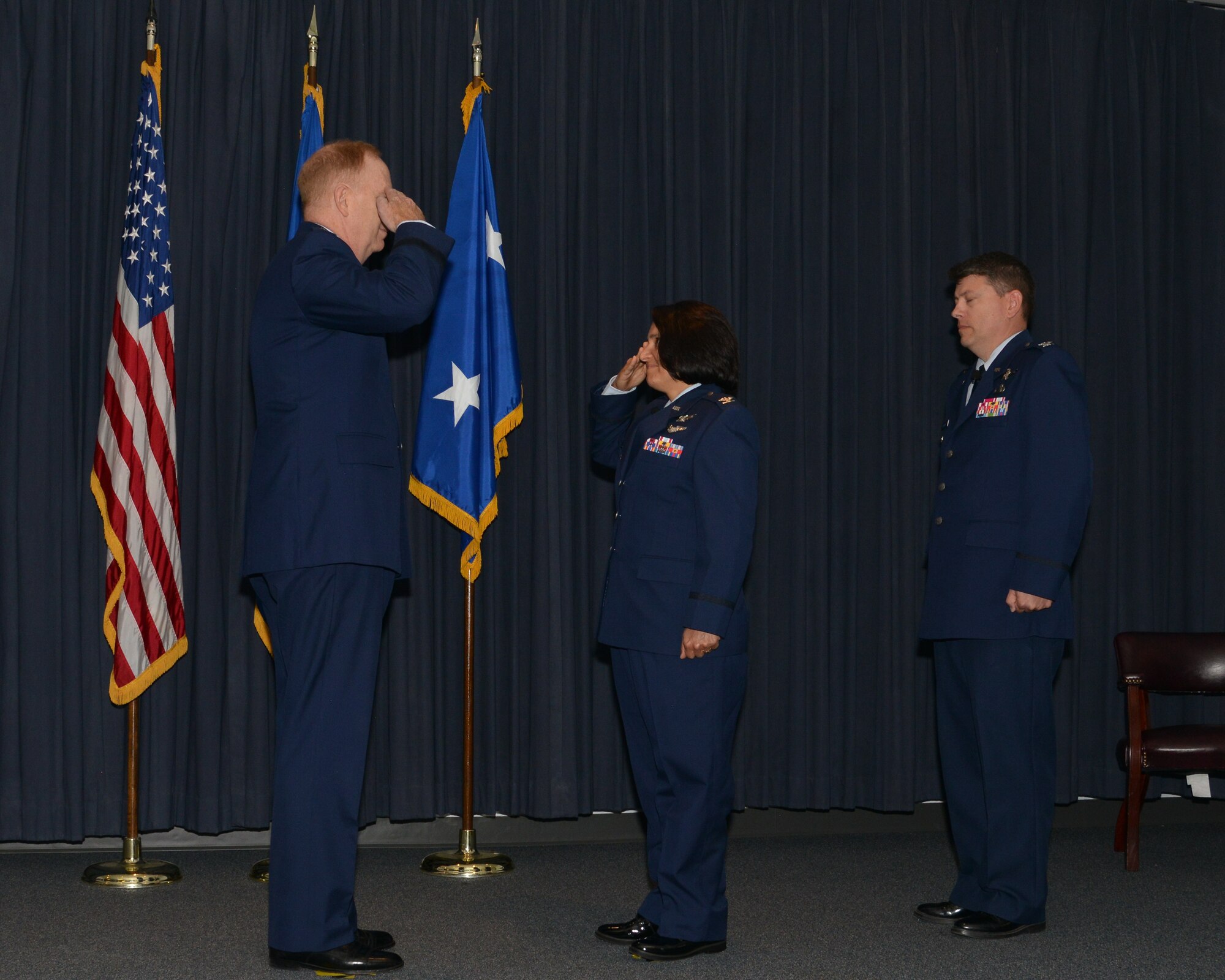 Col. Shahnaz Punjani, incoming director of the Operationally Responsive Space Office salutes presiding officer Maj. Gen. Robert McMurry, Space and Missile Systems Center vice commander during a change of command ceremony at Kirtland Air Force Base, N.M. Aug. 17. Looking on is Col. John Anttonen outgoing ORS director who moves over to be director of the Advanced Systems and Development Directorate and commander of SMC’s Detachment 1 at Kirtland in an assumption of command ceremony held later in the day (U.S. Air Force courtesy photo) 