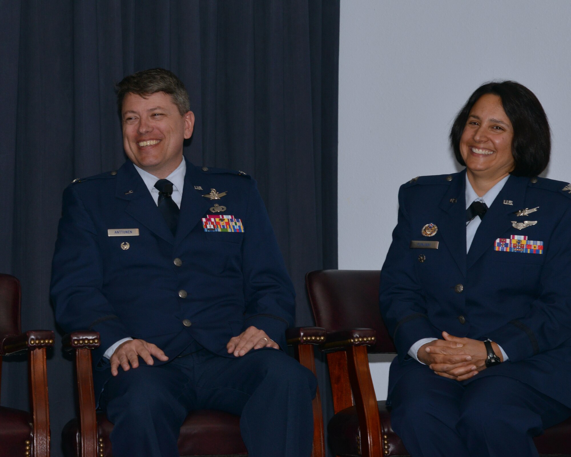 Col. John S.R. Anttonen, outgoing Operationally Responsive Space Office director and Col. Shahnaz Punjani, incoming director of ORS share a light moment during the change of command ceremony at Kirtland Air Force Base, N.M. Aug. 17. Anttonen moves over to be director of the Advanced Systems and Development Directorate and commander of Space and Missile Systems Center’s Detachment 1 at Kirtland during an assumption of command ceremony held later in the day (U.S. Air Force courtesy photo) 
