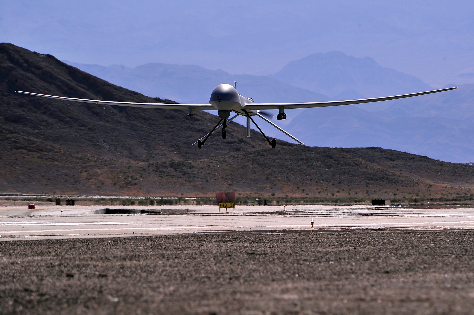 An MQ-1B Predator remotely piloted aircraft comes in for a 'touch-and-go' during a training mission, May 13, 2013. The MQ-1B Predator is an armed, multi-mission, medium-altitude, long-endurance remotely piloted aircraft that is employed primarily as an intelligence-collection asset and secondarily for munitions capability to support ground troops and base defense. (U.S. Air Force photo by 432nd Wing/432nd Air Expeditionary Wing/Released)