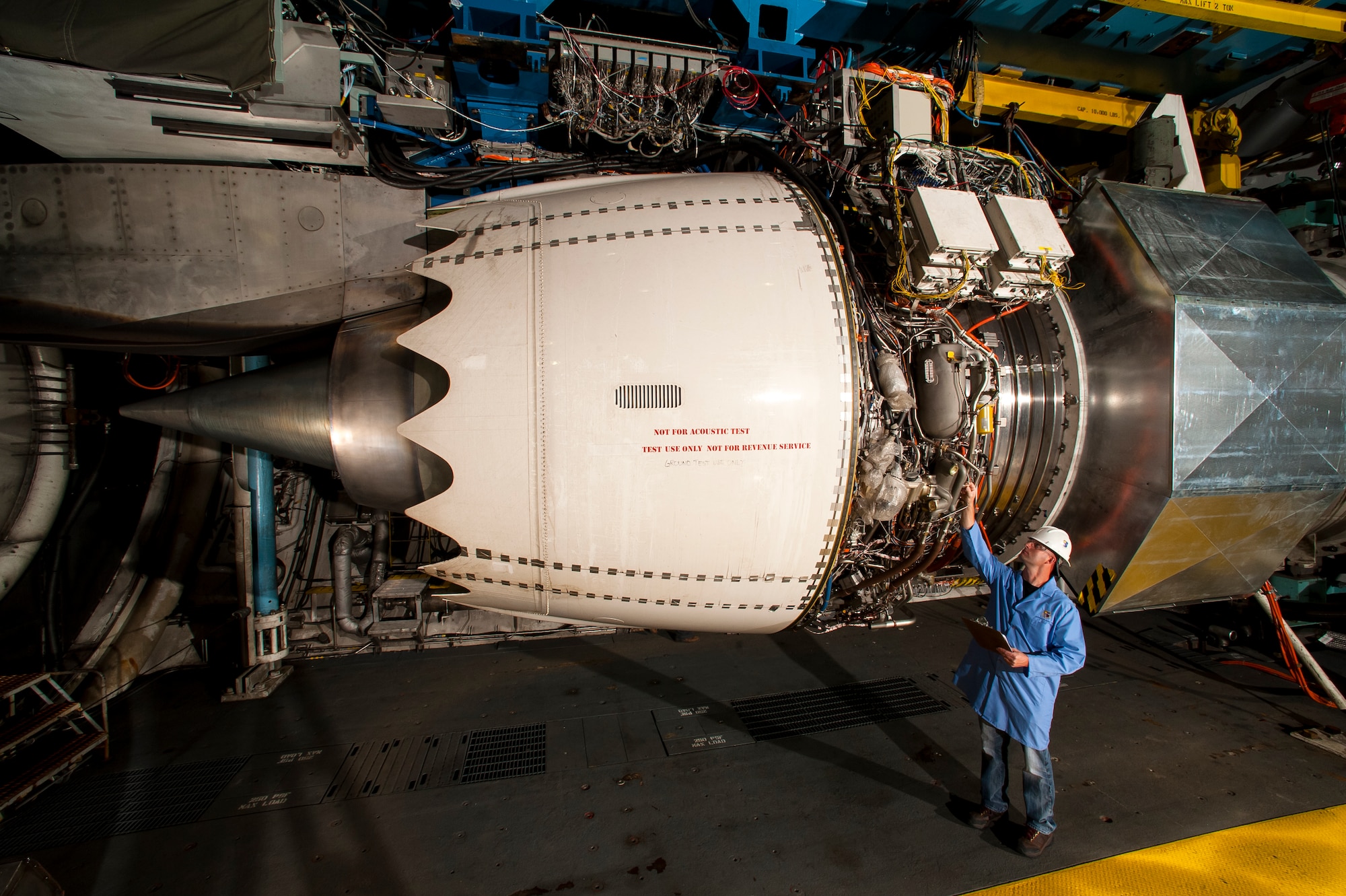 Performance testing on the Rolls-Royce Trent 1000-TEN engine was recently completed in the Aeropropulsion Systems Test Facility (ASTF) C-2 engine test cell at AEDC. Pictured is Eric Brumley, ATA outside machinist, inspecting the engine prior to the test. (Photo by Rick Goodfriend)