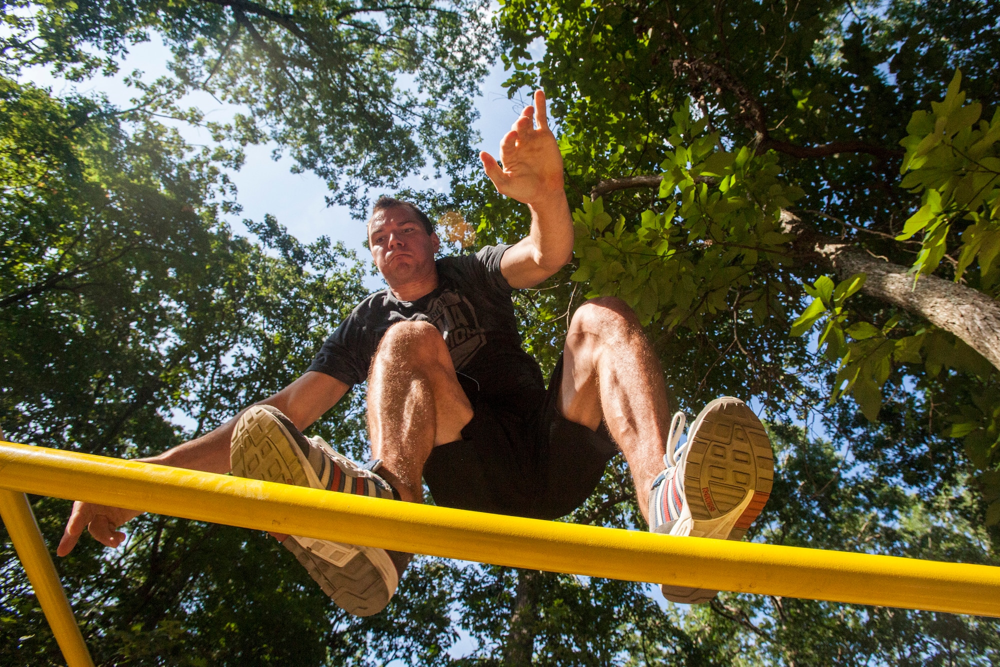 Tech. Sgt. Justin B. Gielski balances on a set of bars he built in the backyard of his home in Medford, N.J.,  as he trains to compete on the TV show “American Ninja Warrior” Aug. 21, 2015. Gielski placed fifth in the all-military city final on the TV show and advanced to the finals in Las Vegas. Gielski is a loadmaster with the 150th Special Operations Squadron, 108th Wing, New Jersey Air National Guard, located at Joint Base McGuire-Dix-Lakehurst, N.J. (U.S. Air National Guard photo by Master Sgt. Mark C. Olsen/Released)