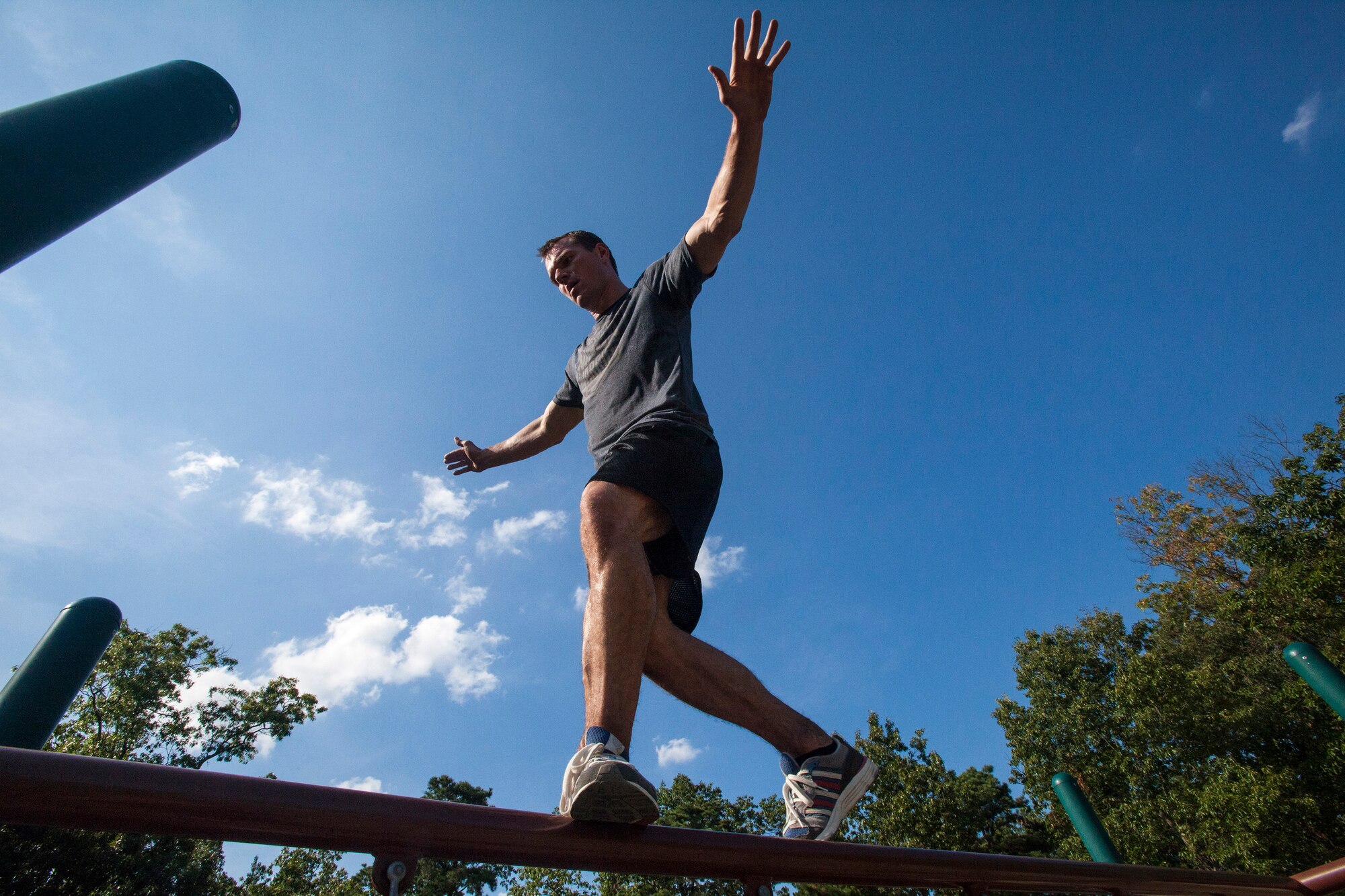 Tech. Sgt. Justin B. Gielski maintains his balance while training to compete on the TV show “American Ninja Warrior” at a playground near his home in Medford, N.J., Aug. 21, 2015. Gielski placed fifth in the all-military city final on the TV show and advanced to the finals in Las Vegas. Gielski is a loadmaster with the 150th Special Operations Squadron, 108th Wing, New Jersey Air National Guard, located at Joint Base McGuire-Dix-Lakehurst, N.J. (U.S. Air National Guard photo by Master Sgt. Mark C. Olsen/Released)