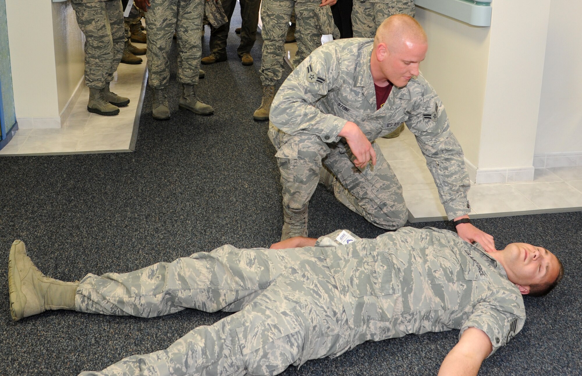 Airman 1st Class Spencer Stone, 65th Medical Operations Squadron, reacts to
a mock medical emergency situation during a briefing by the 65th Medical
Group for Maj. Gen. Christopher Bence, 3rd Air Force and 17th Expeditionary
Air Force vice commander, on Lajes Field, Azores, Portugal, April 17, 2015.
(U.S. Air Force photo by Guido Melo).