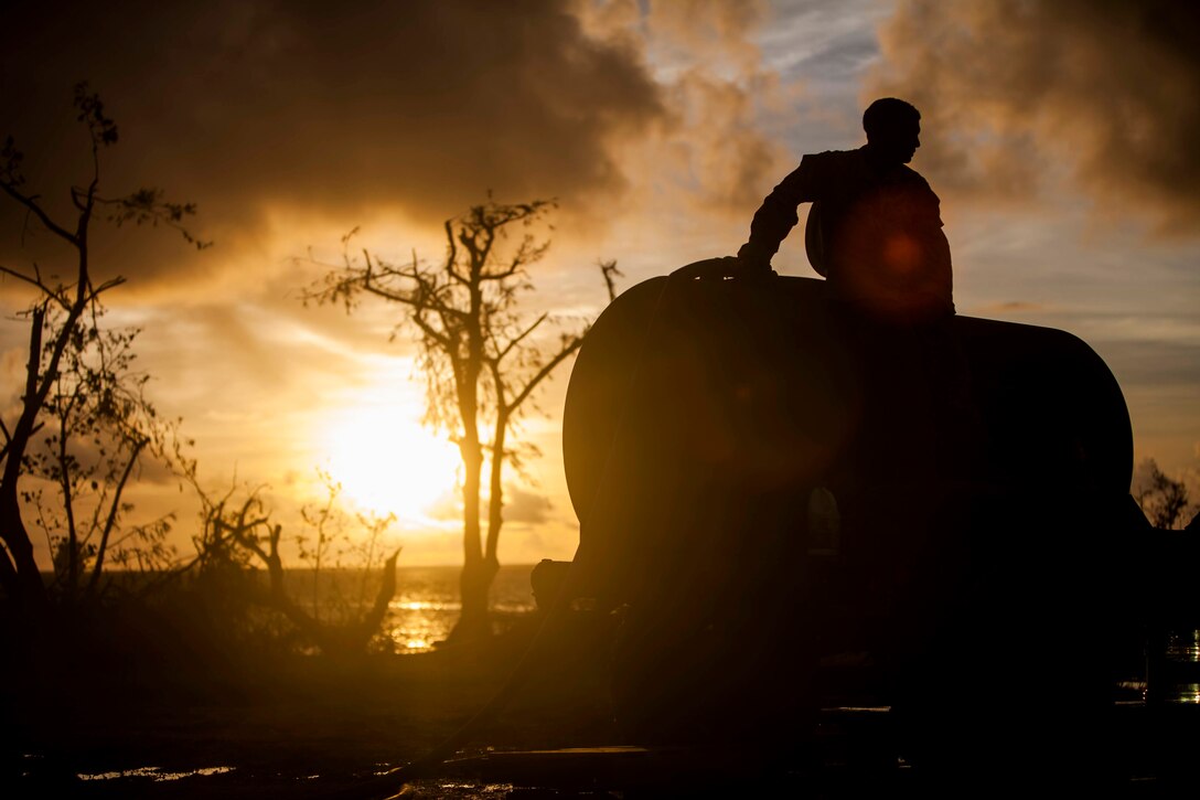 U.S. Marine Lance Cpl. Riley Remoket, with Combat Logistics Battalion 31, 31st Marine Expeditionary Unit, fills a water bull at a water distribution site during typhoon relief efforts in Saipan, Aug. 19, 2015. The Marines with Echo Company, Battalion Landing Team 2nd Battalion, 5th Marines, 31st MEU and CLB 31, 31st MEU, assisted the locals of Saipan by producing and distributing potable water. The Marines and sailors of the 31st MEU were conducting training near the Mariana Islands when they were redirected to Saipan after the island was struck by Typhoon Soudelor Aug. 2-3. 