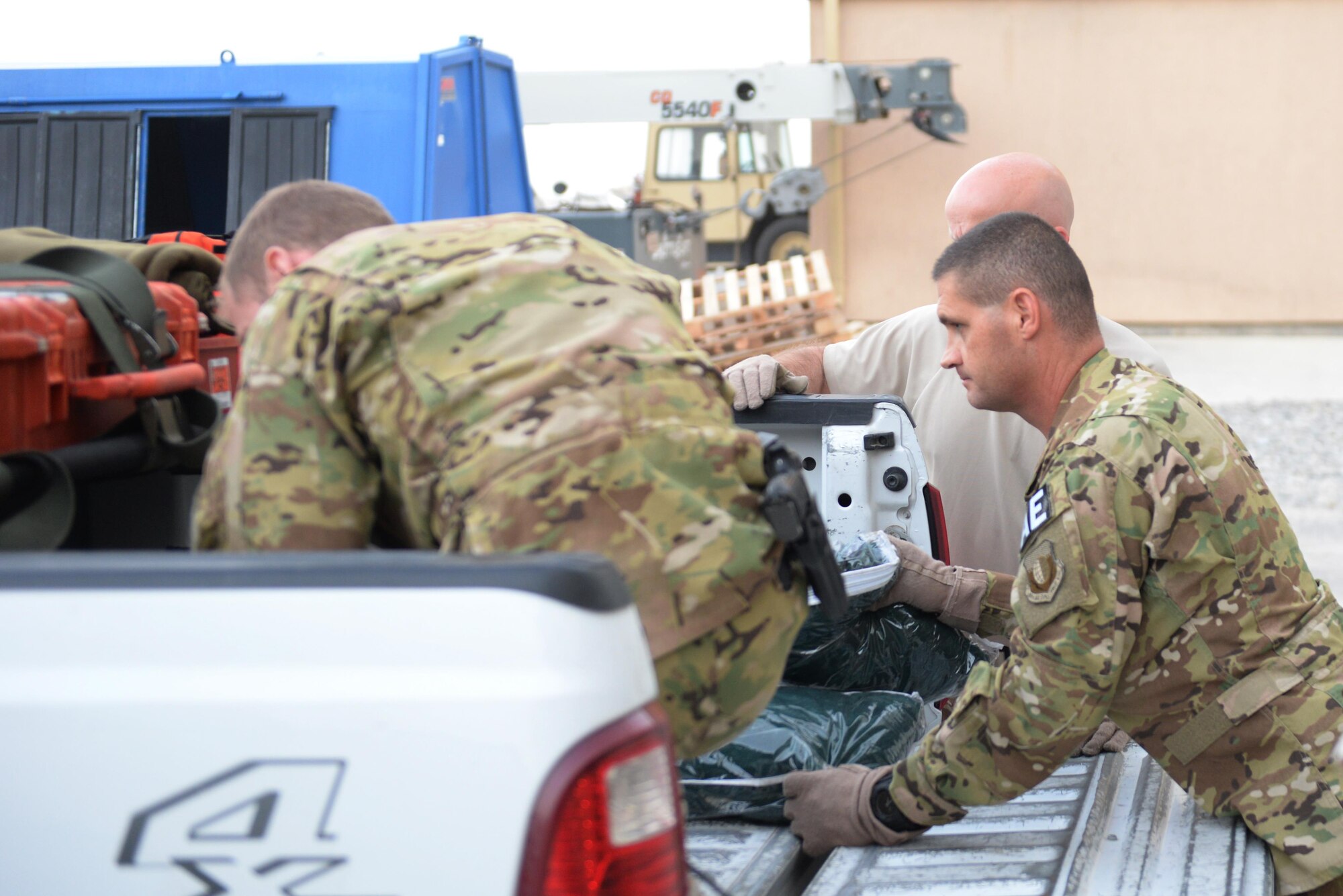 U.S. Air Force Tech. Sgt. Russell “Rusty” McLamb, right, 455th Expeditionary Aeromedical Evacuation Squadron technician deployed from the North Carolina Air National Guard’s 156th Aeromedical Evacuation Squadron, load equipment to take to a -17 Globemaster III aircraft on the flight line at Bagram Airfield, Afghanistan, Aug. 8, 2015. McLamb is part of the 455th EAES, which is responsible for evacuating the sick and wounded from Central Command to higher echelons of medical care. (U.S. Air Force photo by Maj. Tony Wickman/Released)