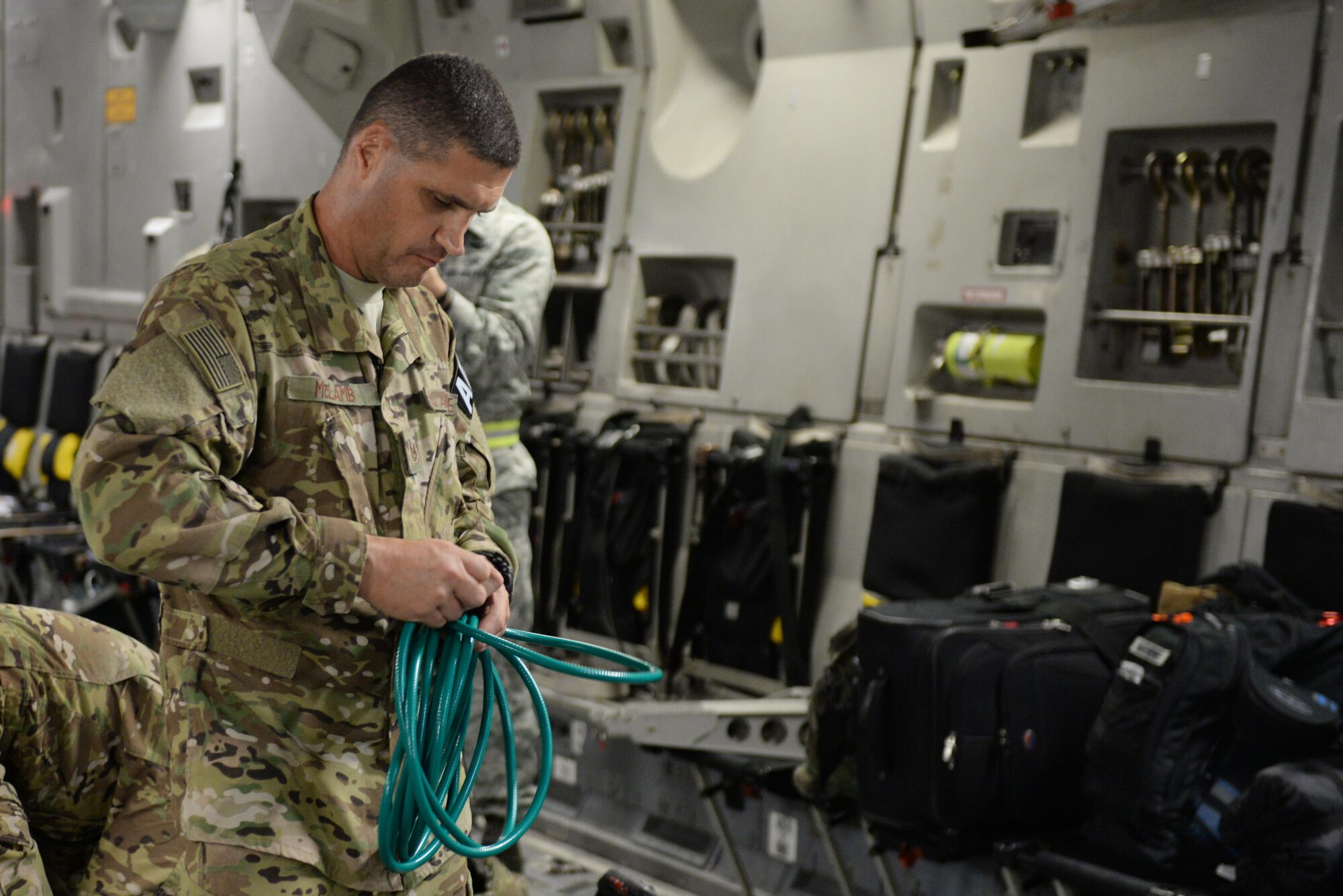 U.S. Air Force Tech. Sgt. Russell “Rusty” McLamb, 455th Expeditionary Aeromedical Evacuation Squadron technician deployed from the North Carolina Air National Guard’s 156th Aeromedical Evacuation Squadron, breaks down electrical and oxygen lines for medical equipment on a C-17 Globemaster III aircraft on the flight line at Ramstein Air Base, Germany, Aug. 9, 2015, after an aeromedical evacuation mission from Bagram Airfield, Afghanistan. McLamb is part of the 455th EAES, which is responsible for evacuating the sick and wounded from Central Command to higher echelons of medical care. (U.S. Air Force photo by Maj. Tony Wickman/Released)
