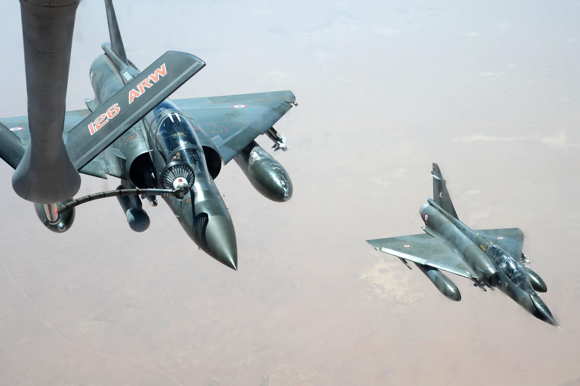 A U.S. Air Force KC-135 Stratotanker refuels a French Dassault Mirage over Southwest Asia in support of Operation Inherent Resolve, Aug. 20, 2015. OIR is the military intervention against Daesh. (U.S. Air Force photo by Staff Sgt. Sandra Welch) 