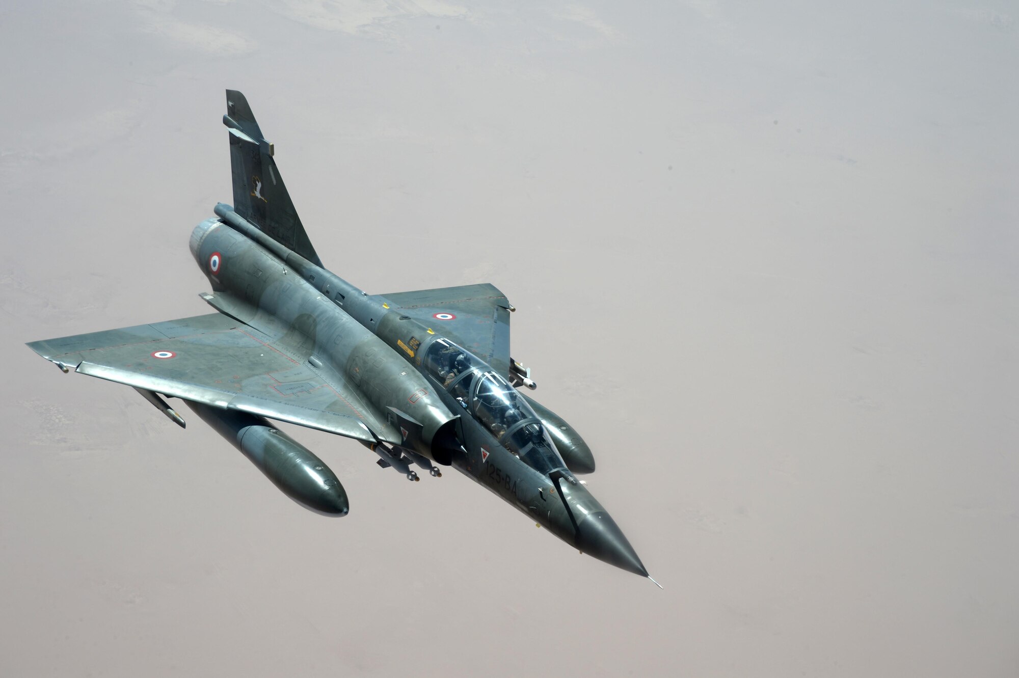 A French Dassault Mirage waits to be refueled by a U.S. KC-135 Stratotanker over Southwest Asia in support of Operation Inherent Resolve, Aug. 20, 2015. OIR is the military intervention against Daesh. (U.S. Air Force photo by Staff Sgt. Sandra Welch)