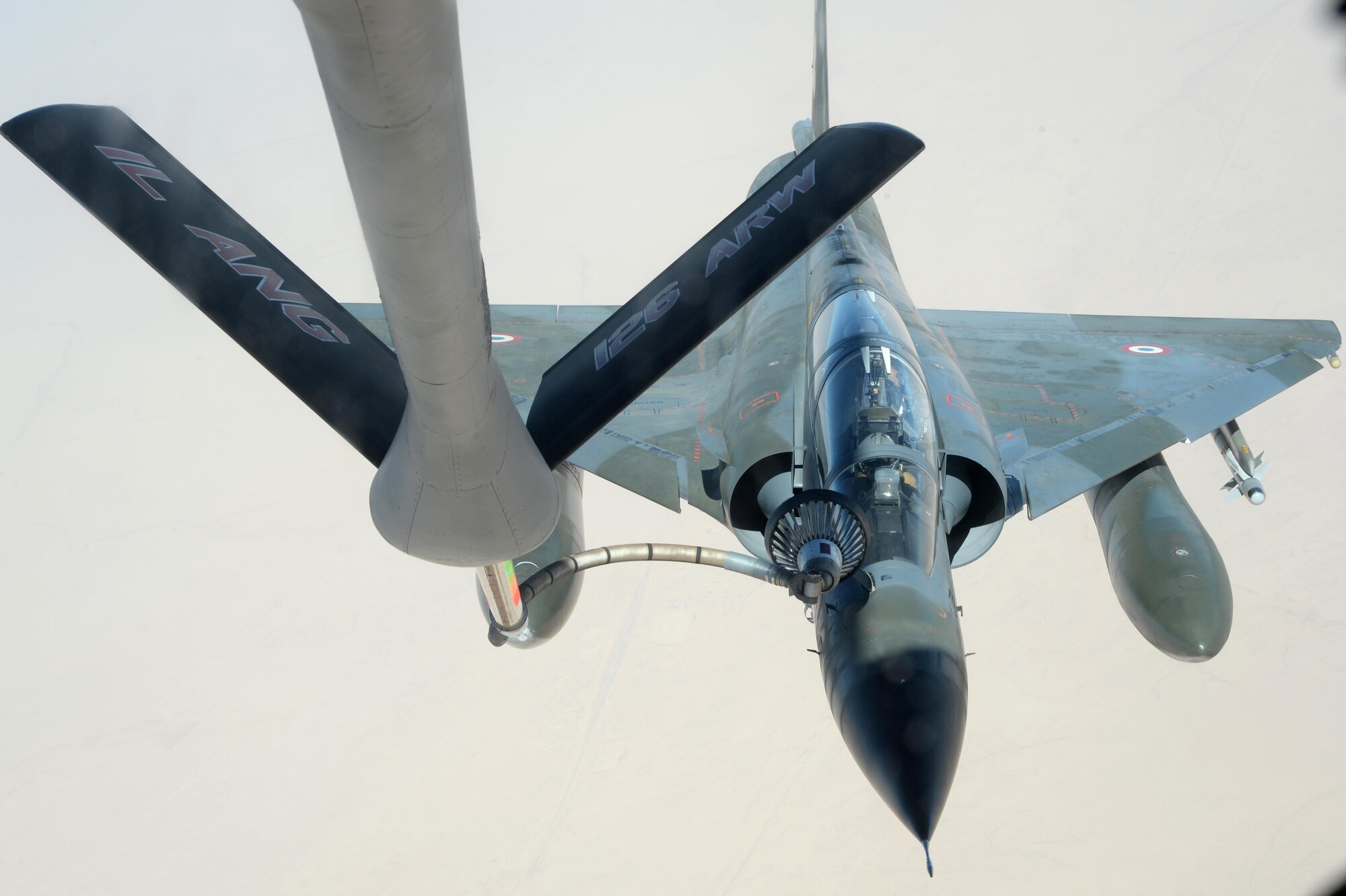 A U.S. Air Force KC-135 Stratotanker refuels a French Dassault Mirage over Southwest Asia in support of Operation Inherent Resolve, Aug. 20, 2015. OIR is the military intervention against Daesh. (U.S. Air Force photo by Staff Sgt. Sandra Welch) 