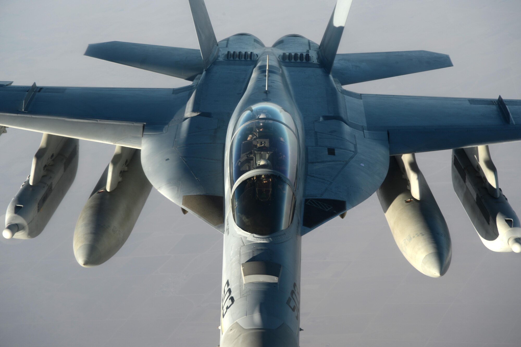 A U.S. Navy EA-18G Growler waits to be refueled by a U.S. Air Force KC-135 Stratotanker over Southwest Asia in support of Operation Inherent Resolve, Aug. 20, 2015. OIR is the military intervention against Daesh. (U.S. Air Force photo by Staff Sgt. Sandra Welch)
