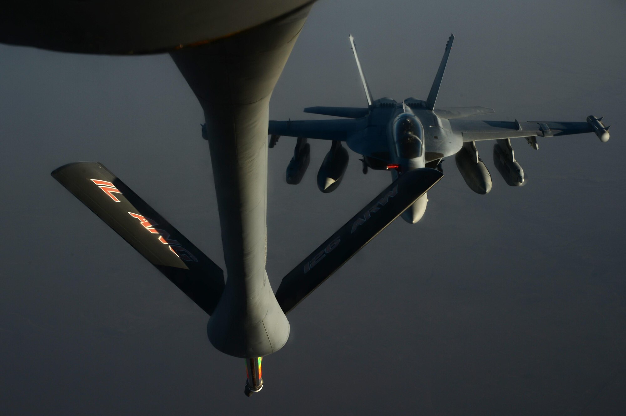 A U.S. Navy EA-18G Growler approaches a U.S. Air Force KC-135 Stratotanker to be refueled over Southwest Asia in support of Operation Inherent Resolve, Aug. 20, 2015. OIR is the military intervention against Daesh. (U.S. Air Force photo by Staff Sgt. Sandra Welch)
