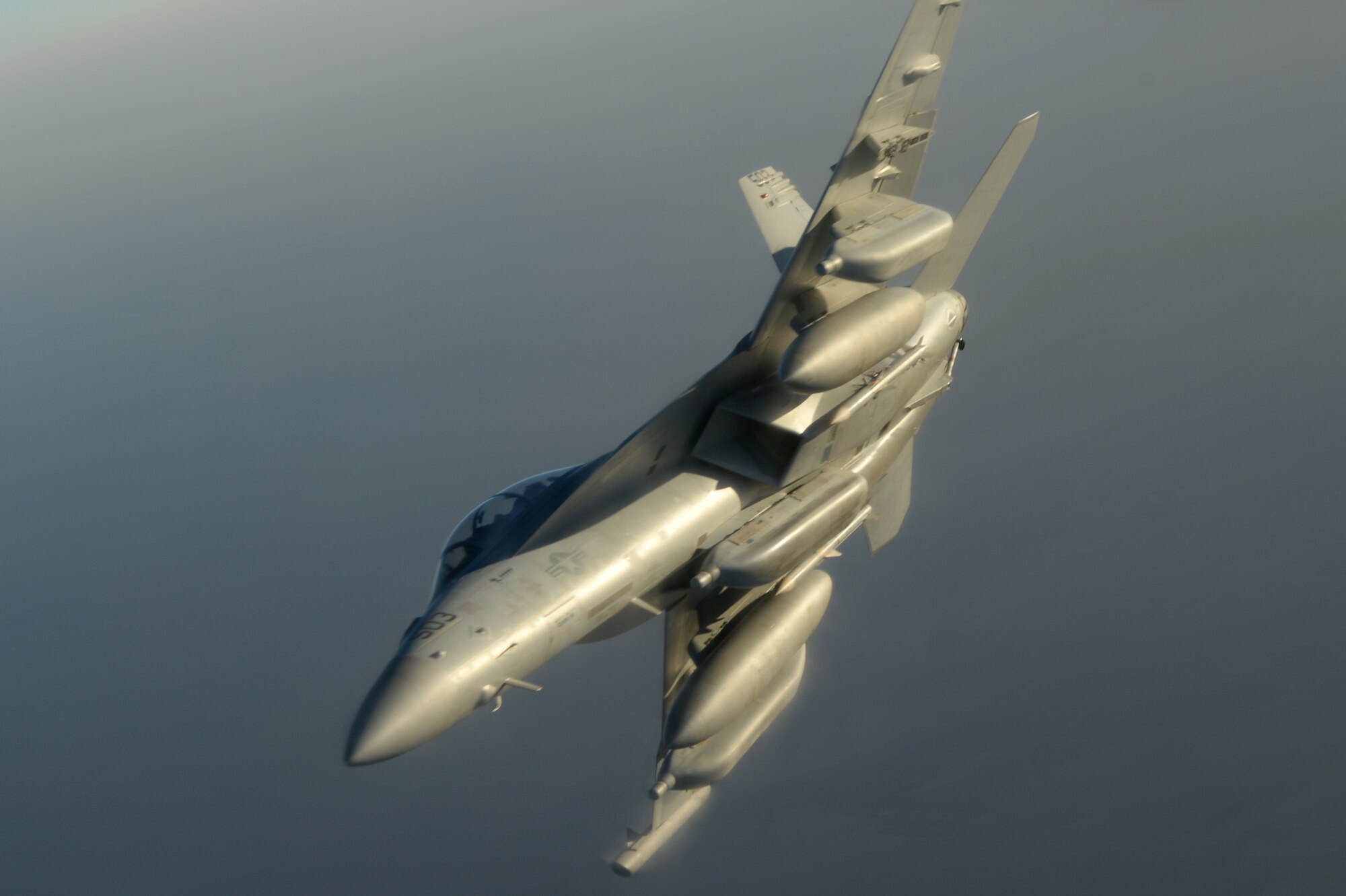 A U.S. Navy EA-18G Growler departs after refueling with a KC-135 Stratotanker over Southwest Asia in support of Operation Inherent Resolve, Aug. 20, 2015. OIR is the military intervention against Daesh. (U.S. Air Force photo by Staff Sgt. Sandra Welch)