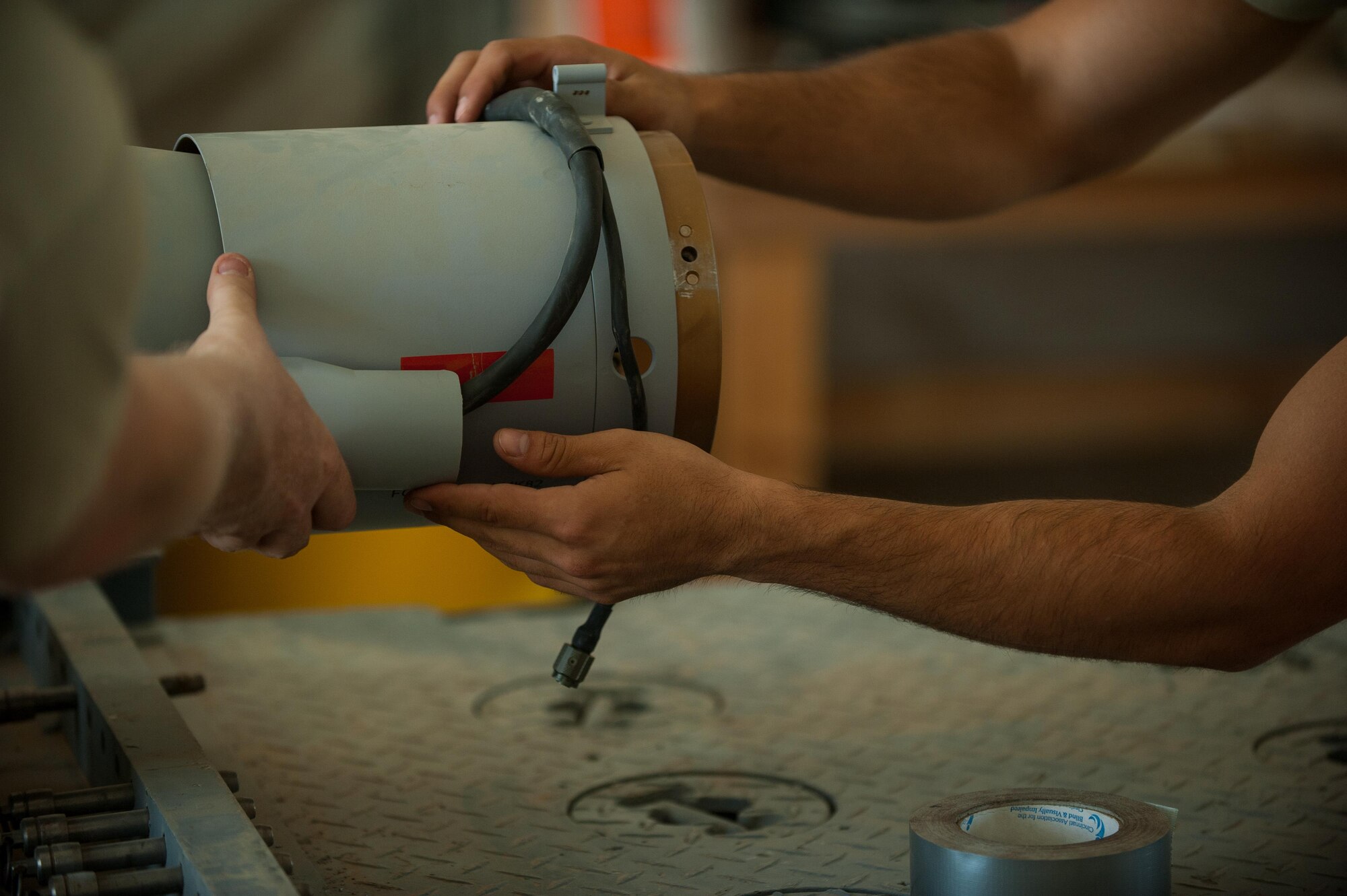 U.S. Air Force Airman 1st Class Matthew Lopez, 62nd Expeditionary Reconnaissance Squadron munitions systems technician, builds a GPS-guided GBU-49 weapon at Kandahar Airfield, Afghanistan, Aug. 15, 2015.  The 62nd ERS Munitions Flight ensures that every munition loaded onto an MQ-1 Predator and MQ-9 Reaper will perform as expected when used. (U.S. Air Force photo by Tech. Sgt. Joseph Swafford/Released)