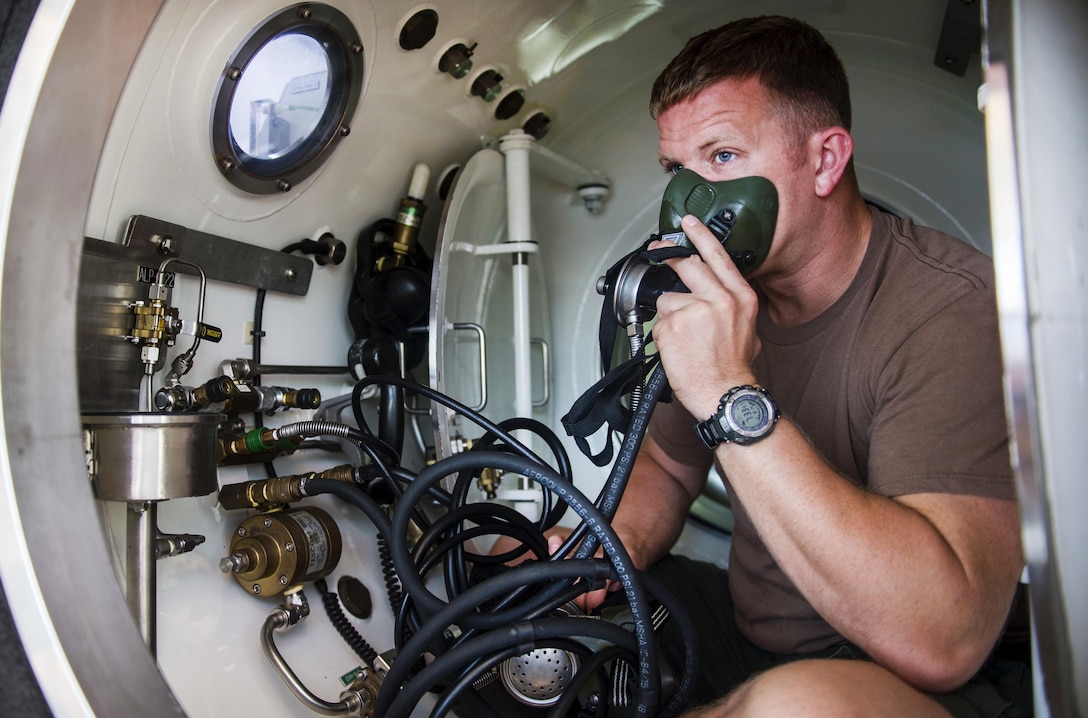 Navy Petty Officer 1st Class Matthew Greiner checks a transportable recompression chamber before a dive in Savannah, Ga., Aug. 14, 2015. Greiner is assigned to Mobile Diving and Salvage Unit 2. Navy divers assigned to the unit and Explosive Ordnance Disposal technicians assigned to Mobile Unit 6 worked with archaeologists, conservationists, members of the Naval History and Heritage Command and the Army engineers on a Navy project to salvage and preserve the CSS Georgia steamship. U.S. Navy photo by Petty Officer 1st Class Blake Midnight