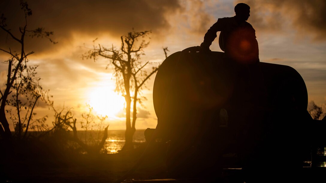U.S. Marine Lance Cpl. Riley Remoket, with Combat Logistics Battalion 31, 31st Marine Expeditionary Unit, fills a water bull at a water distribution site during typhoon relief efforts in Saipan, Aug. 19, 2015. The Marines with Echo Company, Battalion Landing Team 2nd Battalion, 5th Marines, 31st MEU and CLB 31, 31st MEU, assisted the locals of Saipan by producing and distributing potable water. The Marines and sailors of the 31st MEU were conducting training near the Mariana Islands when they were redirected to Saipan after the island was struck by Typhoon Soudelor Aug. 2-3. 
