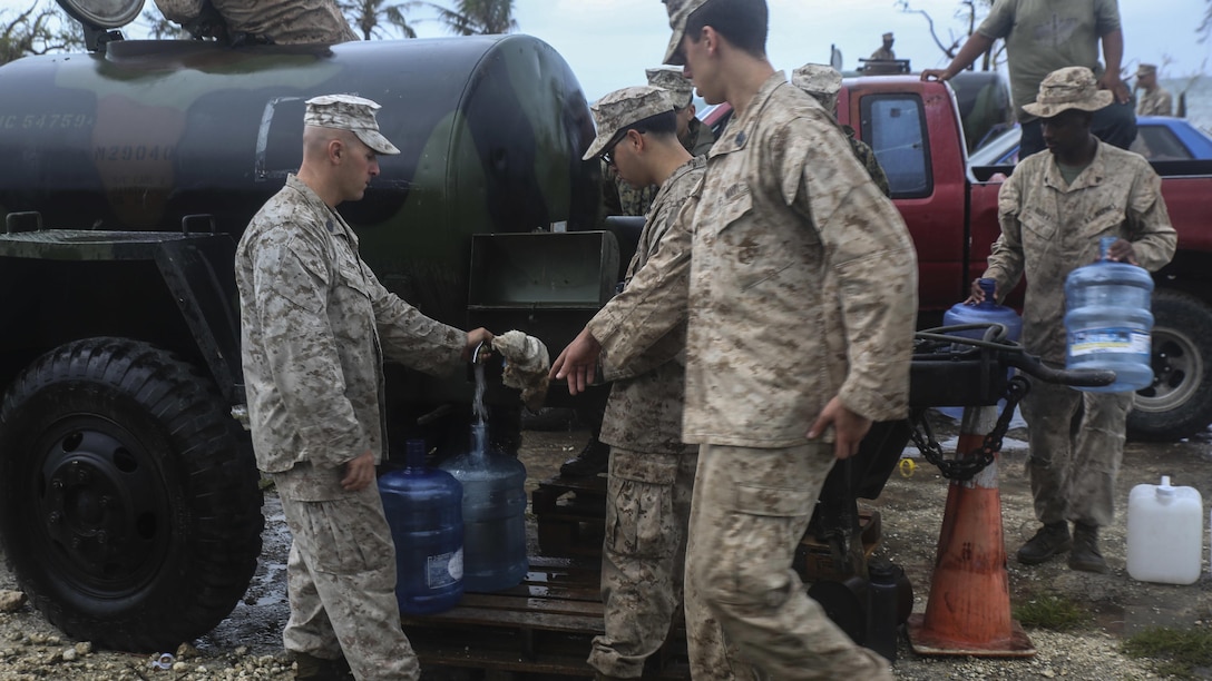 U.S. Marines fill up water jugs for locals as part of a typhoon relief mission in Saipan, Aug. 15, 2015. The Marines with Echo Company, Battalion Landing Team 2nd Battalion, 5th Marine Regiment, 31st Marine Expeditionary Unit, and Combat Logistics Battalion 31, 31st MEU, assisted the locals of Saipan by producing and distributing potable water. The Marines and sailors of the 31st MEU were conducting training near the Mariana Islands when they were redirected to Saipan after the island was struck by Typhoon Soudelor Aug. 2-3. 