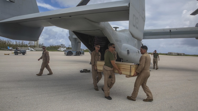 U.S. Marines unload gear from a MV-22B Osprey assigned to Marine Medium Tiltrotor Squadron 265 (Reinforced), 31st Marine Expeditionary Unit, as a part of a typhoon relief mission in Saipan, Aug. 12, 2015. The Marines of VMM-265 (Rein.), 31st MEU, flew emergency relief supplies into Saipan to assist with typhoon relief efforts. The Marines and sailors of the 31st MEU were conducting training near the Mariana Islands when they were redirected to Saipan after the island was struck by Typhoon Soudelor Aug. 2-3.