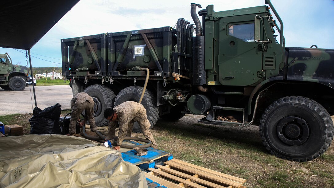 U.S. Marines refill a water bladder at a water distribution site as a part of a typhoon relief mission in Saipan Aug. 13, 2015. The Marines with Echo Company, Battalion Landing Team 2nd Battalion, 5th Marines, 31st Marine Expeditionary Unit and Combat Logistics Battalion 31, 31st MEU, assisted the locals of Saipan by producing and distributing potable water. The Marines and sailors of the 31st MEU were conducting training near the Mariana Islands when they were redirected to Saipan after the island was struck by Typhoon Soudelor Aug. 2-3. 