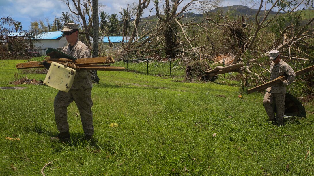 U.S. Marines clear debris at a high school as part of a typhoon relief mission in Saipan Aug. 12, 2015 The Marines with Echo Company, Battalion Landing Team 2nd Battalion, 5th Marines, 31st Marine Expeditionary Unit and Combat Logistics Battalion 31, 31st MEU, assisted the locals of Saipan by clearing debris from several schools. The Marines and sailors of the 31st MEU were conducting training near the Mariana Islands when they were redirected to Saipan after the island was struck by Typhoon Soudelor Aug. 2-3. 