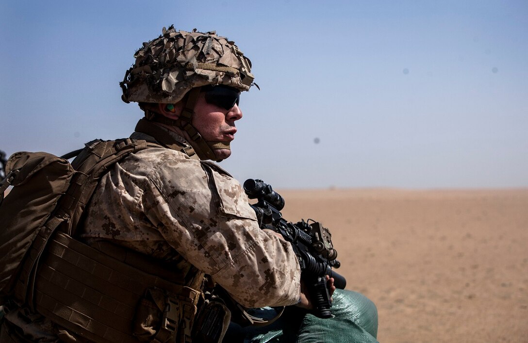 A U.S. Marine with Lima Company, Battalion Landing Team 3rd Battalion, 1st Marine Regiment, 15th Marine Expeditionary Unit (MEU), calls out commands as his fire-team buddy-rushes their targets. Elements of the 15th MEU are ashore in Kuwait for sustainment training to maintain and enhance the skills they developed during their pre-deployment training period. The 15th MEU is embarked on the Essex Amphibious Ready Group and deployed to maintain regional security in the U.S. 5th Fleet area of operations. (U.S. Marine Corps photo by Cpl. Elize McKelvey/Released)