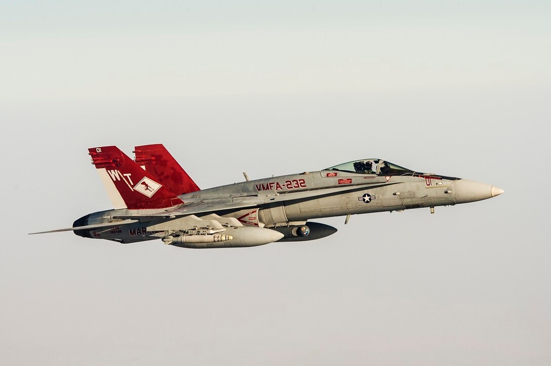 A U.S. Marine Corps F/A-18 with Marine Fighter Attack Squadron 232 link up and perform an Air to Air refuel with a Royal Canadian Air Force CC-150 Polaris air-to-air refueller during a combat mission in the skies of Iraq on July 19, 2015. The ‘Red Devils’ of VMFA-232 are currently deployed with the Special Purpose Marine Air Ground Task Force-Crisis Response-Central Command and provide offensive strike and close air support to Operation Inherent Resolve and the global fight against the Islamic State of Syria and the Levant. (Courtesy Photo by Op IMPACT)