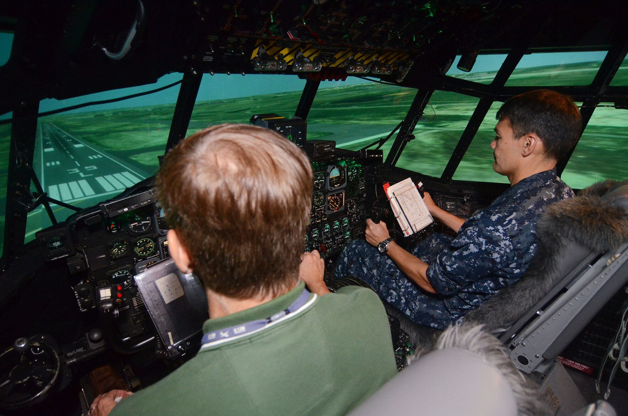 Members of the Honorary Commanders Association experienced a flight in a C-130 simulator during a base tour on Dobbins Air Reserve Base, Ga. Aug. 19, 2015. 
