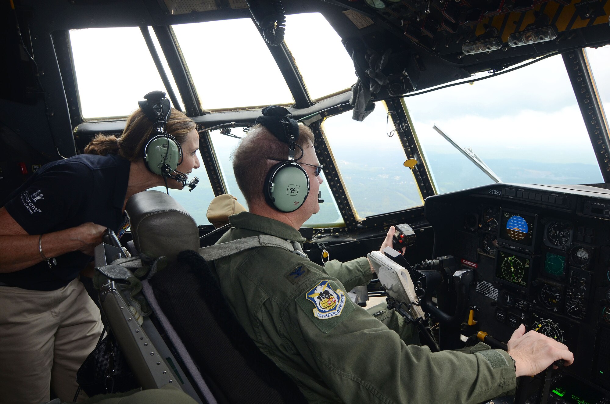 Members of the Honorary Commanders Association took part in Dobbins Day, spending time with personnel, touring, dining and participating in hands-on experiences Aug. 19, 2013. The day concluded with a flight in the C-130 Hercules, command piloted by Col. James Devere, 94th Operations Group commander. 