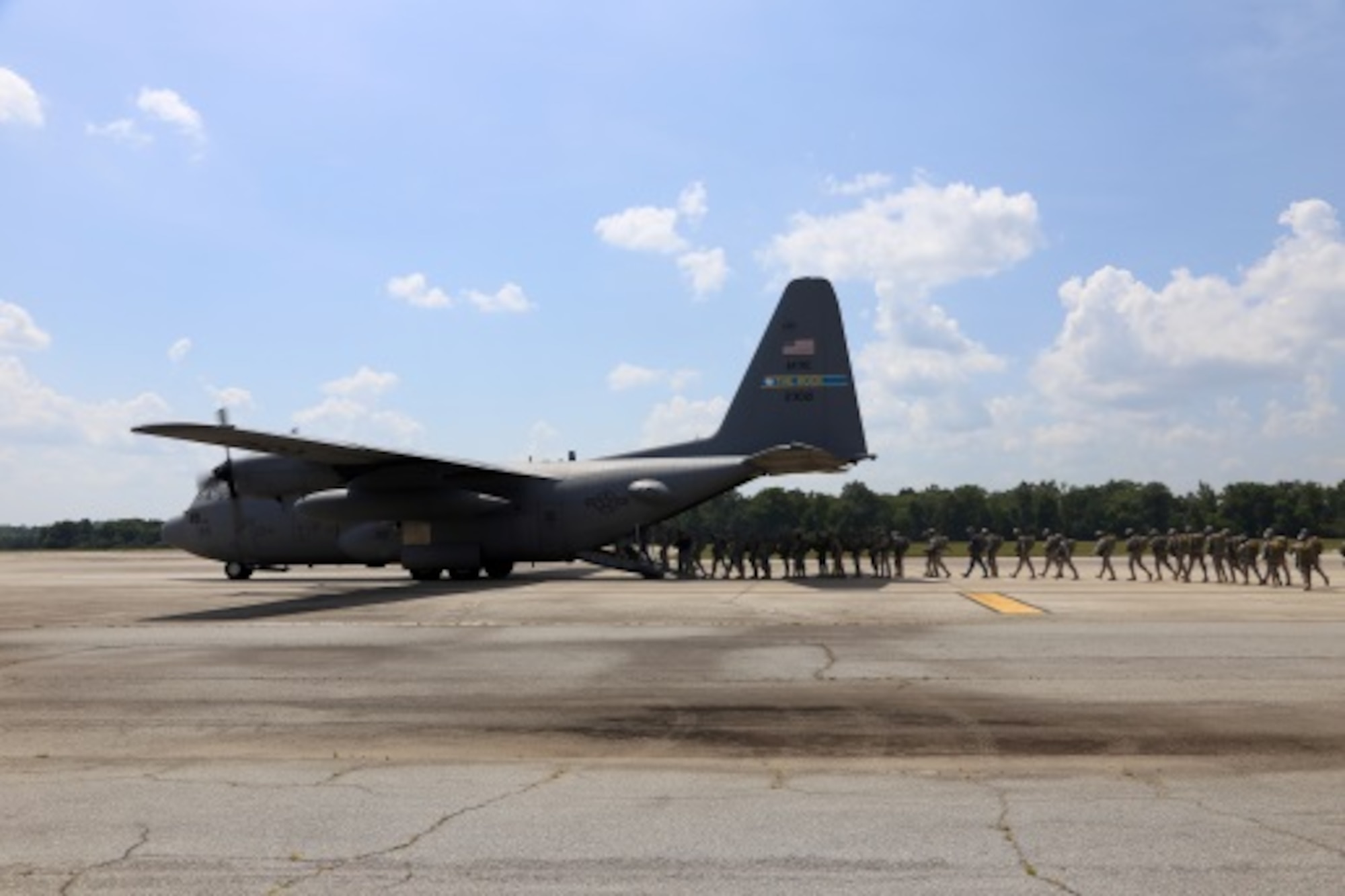 Student paratroopers board a C-130H aircraft at Lawson Army Airfield near Fort Benning, Ga. July 13, 2015. The third and final week of the Basic Airborne Course is known as “Jump Week,” and was supported between July 13-17 by the Air Force Reserve’s 913th Airlift Group from Little Rock Air Force Base, Arkansas and the 302nd Airlift Wing from Peterson Air Force Base. (U.S. Air Force photo/Maj. Mark Withee)