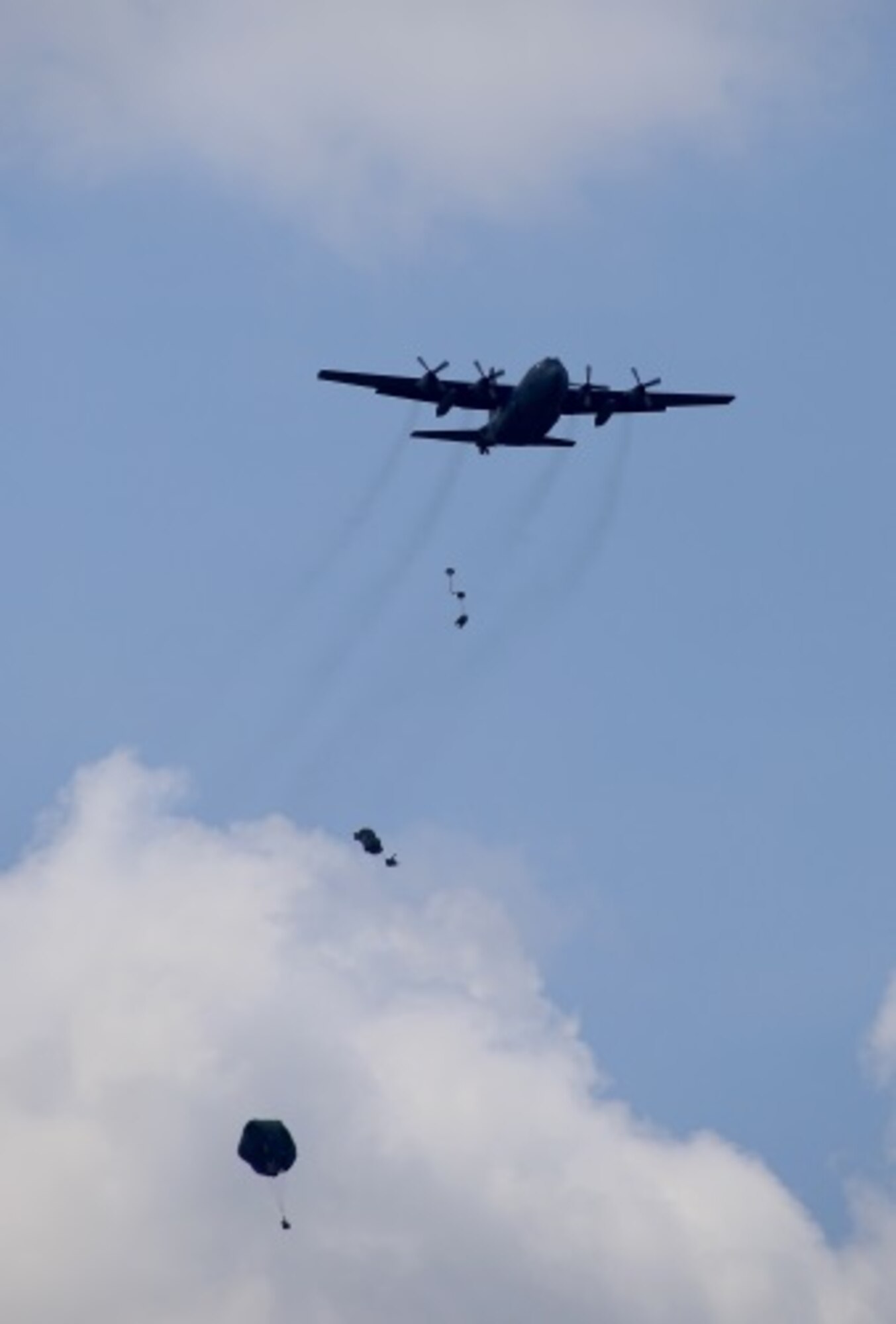 Basic Airborne Course students conduct airborne jumps July 14, 2015 at Fryar Field drop zone at Fort Benning, Ga. July 13, 2015. The student paratroopers’ jump was supported by members from the Air Force Reserve’s 913th Airlift Group from Little Rock Air Force Base, Arkansas and the 302nd Airlift Wing from Peterson Air Force Base. (U.S. Air Force photo/Maj. Mark Withee)