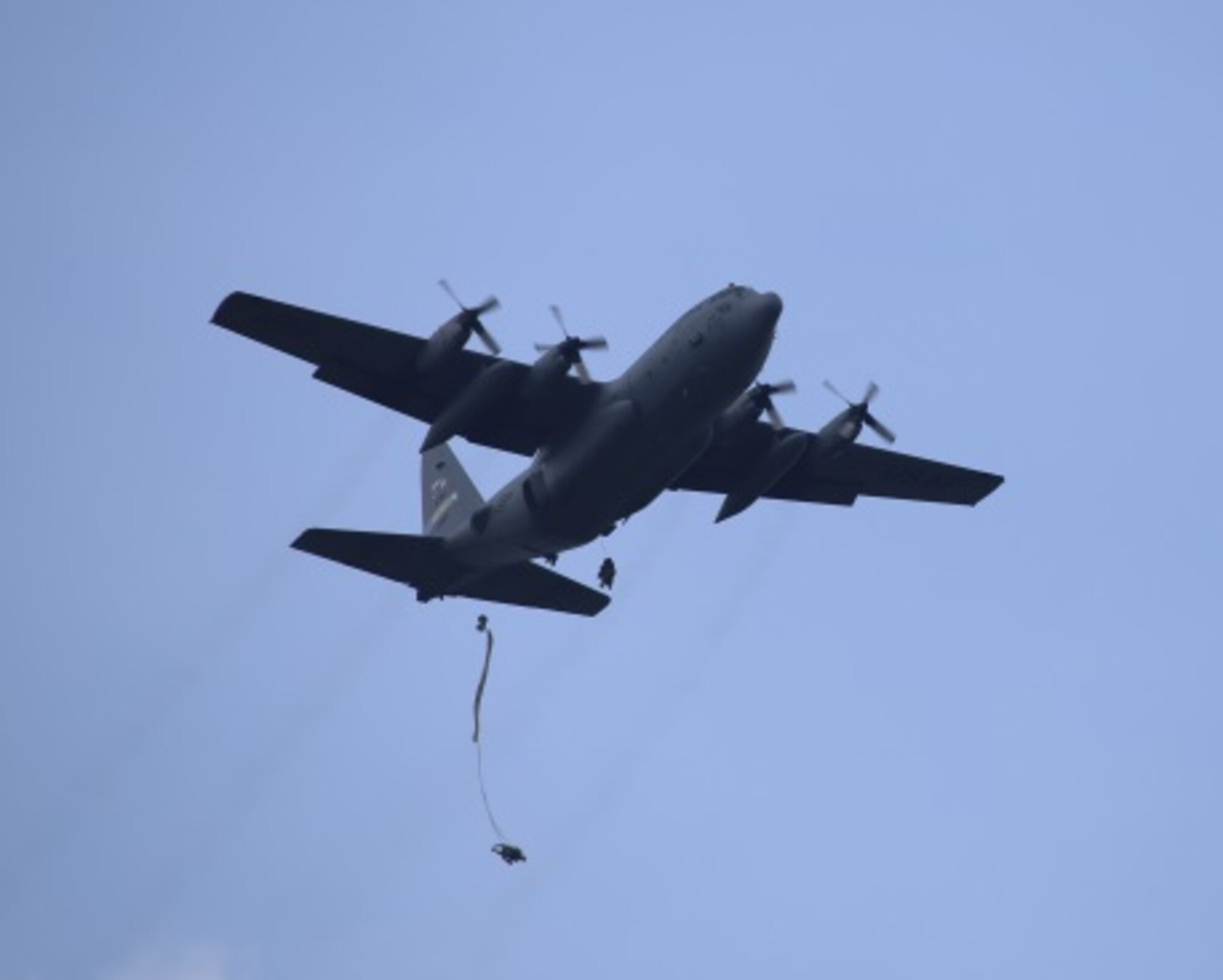 Student paratroopers exit a 913th Airlift Group C-130H as part of the Basic Airborne Course at Fort Benning, Ga. July 13, 2015. Students must make five jumps at 1,250 feet from a C-130 or C-17 aircraft during the third and final week of the course. (U.S. Air Force photo/Maj. Mark Withee)
