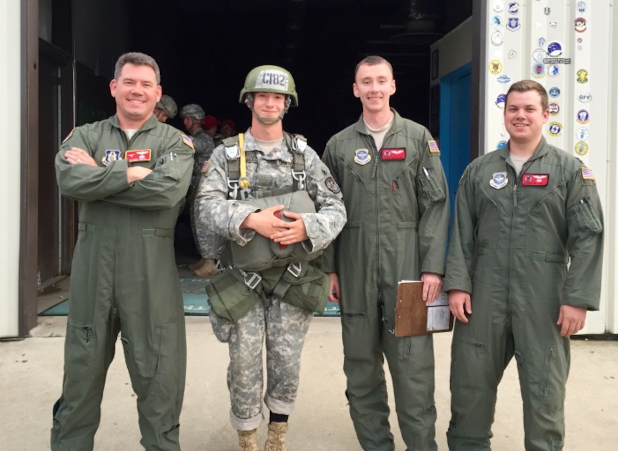 Crewmembers from the 913th Airlift Group pose with an army cadet student paratrooper during the Basic Airborne Course at Fort Benning, Ga. July 13, 2015. The 913th Airlift Group provided airdrop support for the course from July 13-17. (U.S. Air Force photo/Maj. Mark Withee)