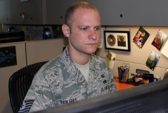 Tech. Sgt. Robert Van Ghle works as an NCO in charge of board operations Aug. 24, 2015, at the Air Reserve Personnel Center on Buckley Air Force Base, Colo. Van Ghle plays drums in the local heavy Christian rock band ofDavid. (U.S. Air Force photo/Tech. Sgt. Rob Hazelett)