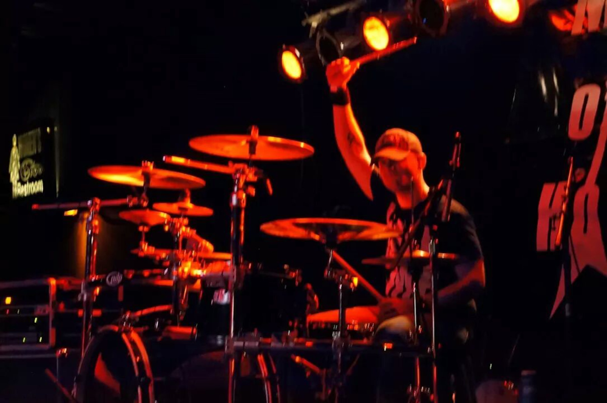 Tech. Sgt. Robert Van Ghle plays drums during a concert with the heavy Christian rock band ofDavid. Van Ghle works as an Air Reserve Personnel Center NCO in charge of board operations on Buckley Air Force Base, Colo. (U.S. Air Force courtesy photo)