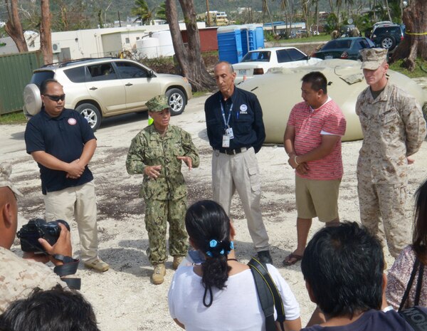 SAIPAN, Northern Mariana Islands (Aug. 22, 2015) - Rear Adm. Bette Bolivar, commander of Joint Region Marianas, speaks with Saipan media during a press conference with Steve DeBlasio, the federal coordinating officer for the Federal Emergency Management Agency, Commonwealth of the Northern Mariana Islands Lt. Gov. Ralph Torres and Lt. Col. Eric Malinowski, liaison for 31st Marine Expeditionary Unit. The press conference addressed the military's involvement in disaster relief efforts in Saipan after Typhoon Soudelor and to announce the departure of the Navy and Marine Corps teams from the island. 