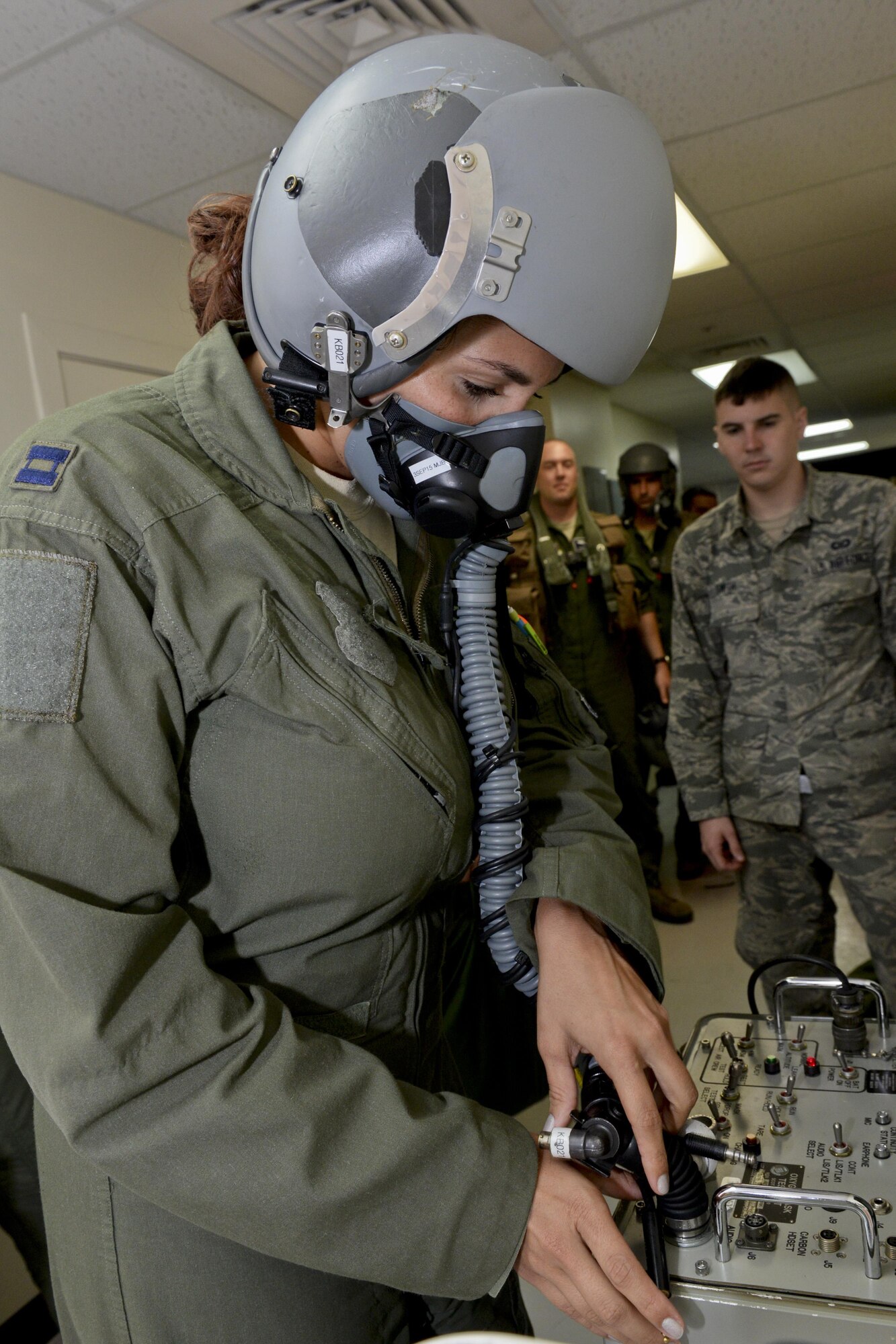 Capt. Marisa Whitaker, U.S. Air Force B-52 Stratofortress aircraft commander, 20th Expeditionary Bomb Squadron from Barksdale Air Force Base, Louisiana, performs preflight checks on her oxygen mask to ensure it is not leaking and the valves are working properly Aug. 22, 2015, at Andersen Air Force Base, Guam.  Whitaker is part of an aircrew that was called upon to support ongoing operations in the Indo-Asia-Pacific region. (U.S. Air Force photo by Staff Sgt. Robert Hicks/Released)