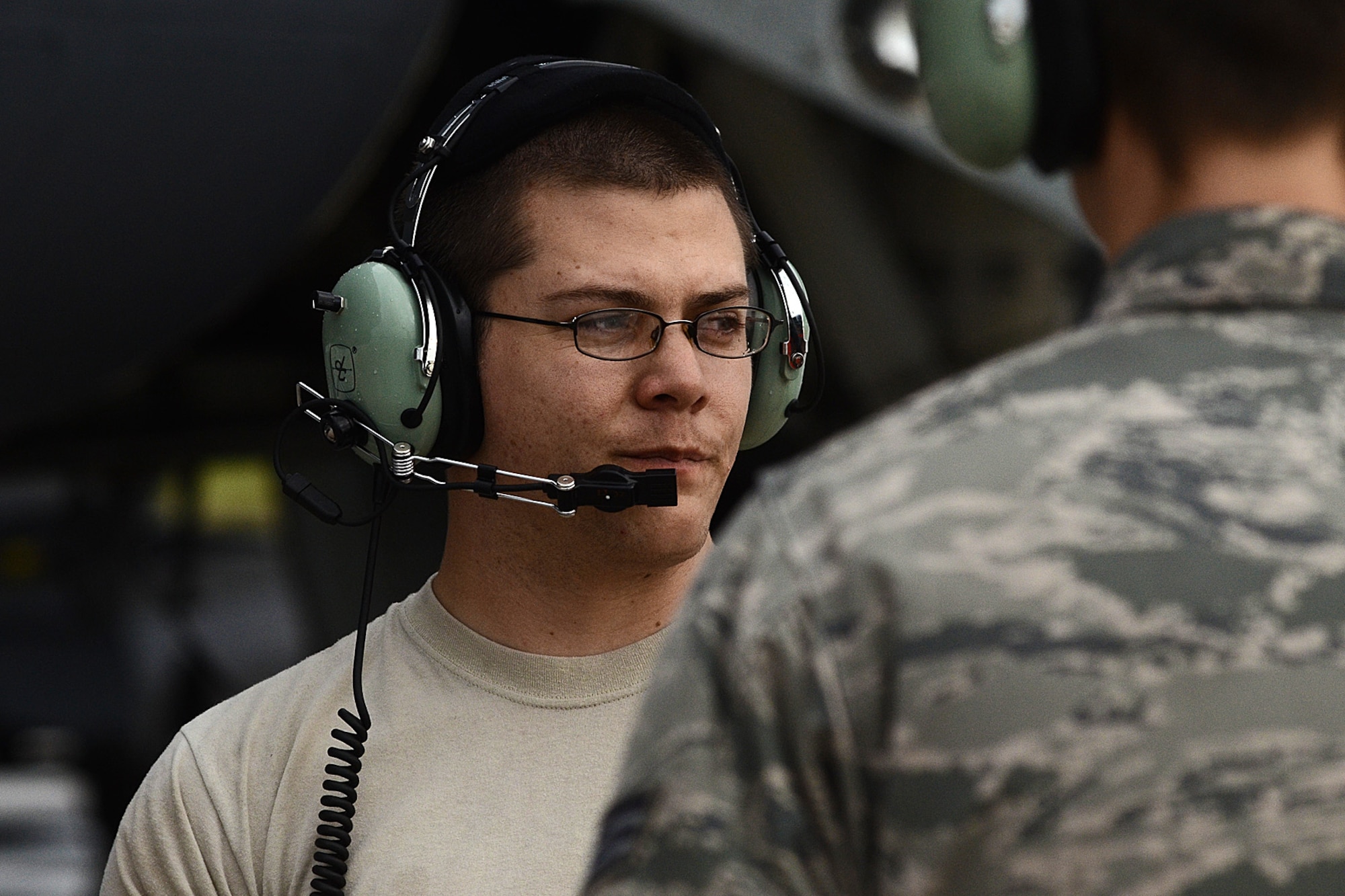 Staff Sgt. Stephen Cole, a U.S. Air Force B-52 Stratofortress crew chief assigned to the 20th Expeditionary Aircraft Maintenance Squadron, talks to his wingmen during preflight operations Aug. 22, 2015, at Andersen Air Force Base, Guam.  Bomber crews with the 20th Expeditionary Bomb Squadron from Barksdale Air Force Base, Louisiana, are part of U.S. Pacific Command’s continuous bomber presence and support ongoing operations in the Indo-Asia-Pacific region. (U.S. Air Force photo by Staff Sgt. Alexander W. Riedel/Released)