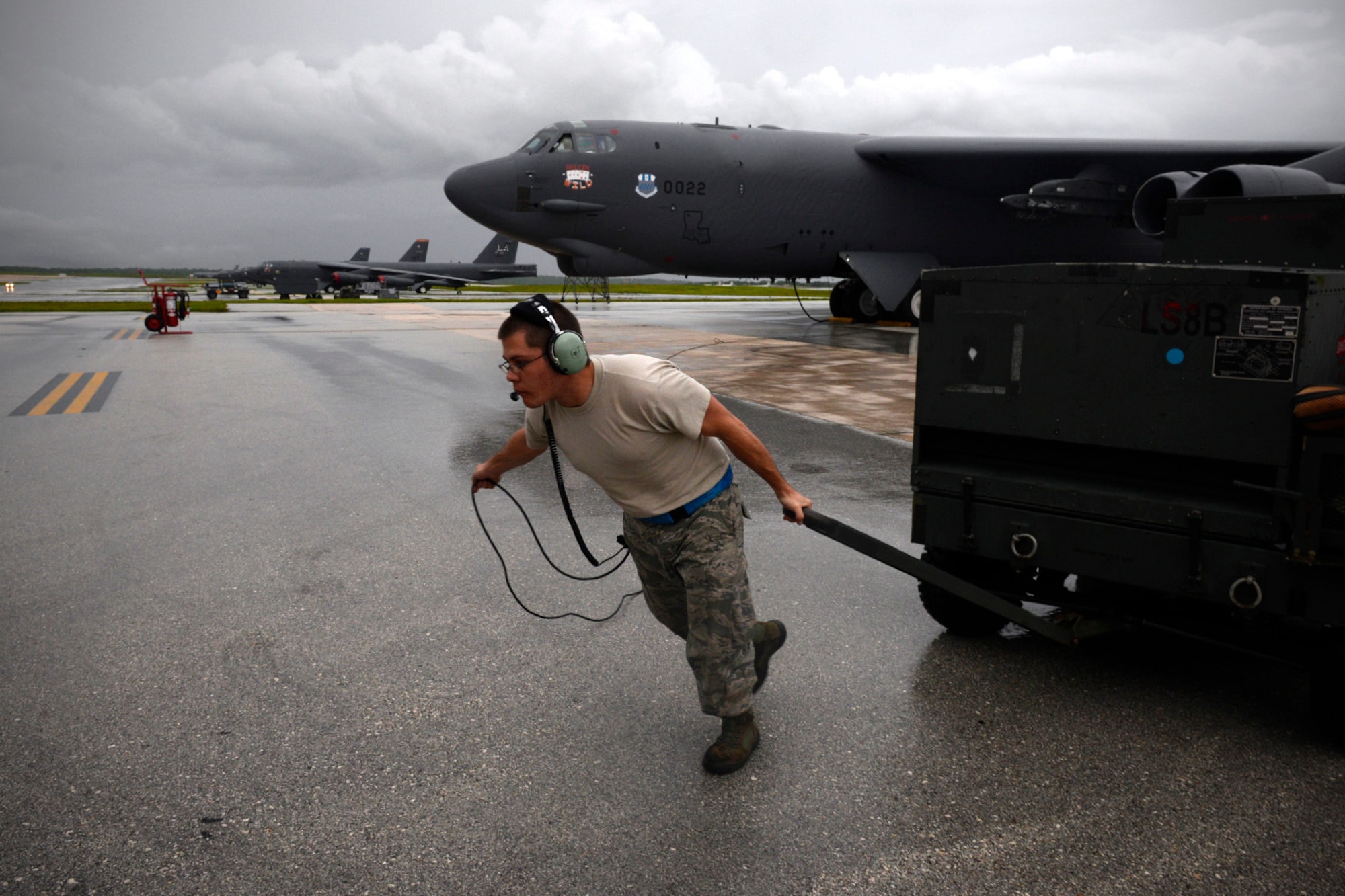 Staff Sgt. Stephen Cole, U.S. Air Force B-52 Stratofortress crew chief assigned to the 20th Expeditionary Aircraft Maintenance Squadron from Barksdale Air Force Base, Louisiana, moves ground equipment during aircraft launch operations Aug. 22, 2015, at Andersen Air Force Base, Guam. Bomber crews with the 20th Expeditionary Bomb Squadron are part of U.S. Pacific Command’s continuous bomber presence and support ongoing operations in the Indo-Asia-Pacific region. (U.S. Air Force photo by Staff Sgt. Alexander W. Riedel/Released)