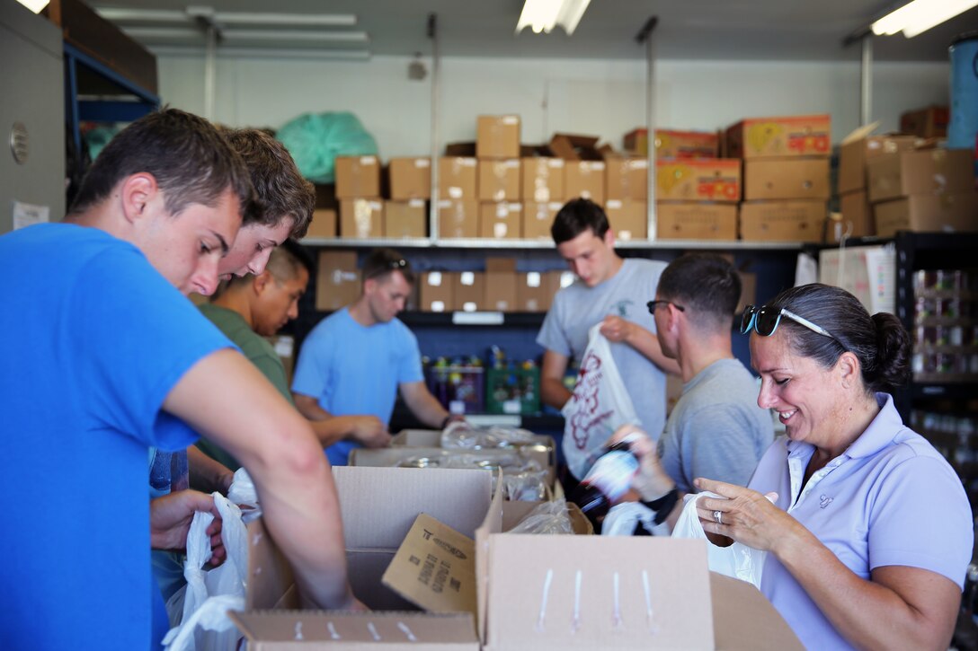 Marines and Sailors with I Marine Expeditionary Force Headquarters Group, I Marine Expeditionary Force, bag food with local volunteers at the Fallbrook Food Pantry in Fallbrook, Calif., Aug. 15, 2015. The Fallbrook Food Pantry collects food donations from local businesses and redistributes the food to families going through difficult times. (USMC photo by Pfc. Devan K. Gowans/Released)
