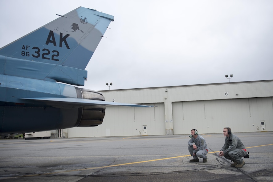 U.S. Air Force Airmen 1st Class Jason Watson and Bryan Bateman, both 354th Aircraft Maintenance Squadron crew chiefs, inspect an 18th Aggressor Squadron F-16 Fighting Falcon, Aug. 19, 2015, prior to the launch of a RED FLAG-Alaska (RF-A) 15-3 sortie from Eielson Air Force Base, Alaska. The support of the 354th Maintenance Group’s Airmen ensure the pilots of the 18th Aggressor Squadron can act as enemy “Red” forces to employ real-world tactics that require coalition “Blue” forces to adjust quickly, work together and overcome challenges during simulated combat sorties throughout RF-A. (U.S. Air Force photo by 1st Lt. Elias Zani/Released)
