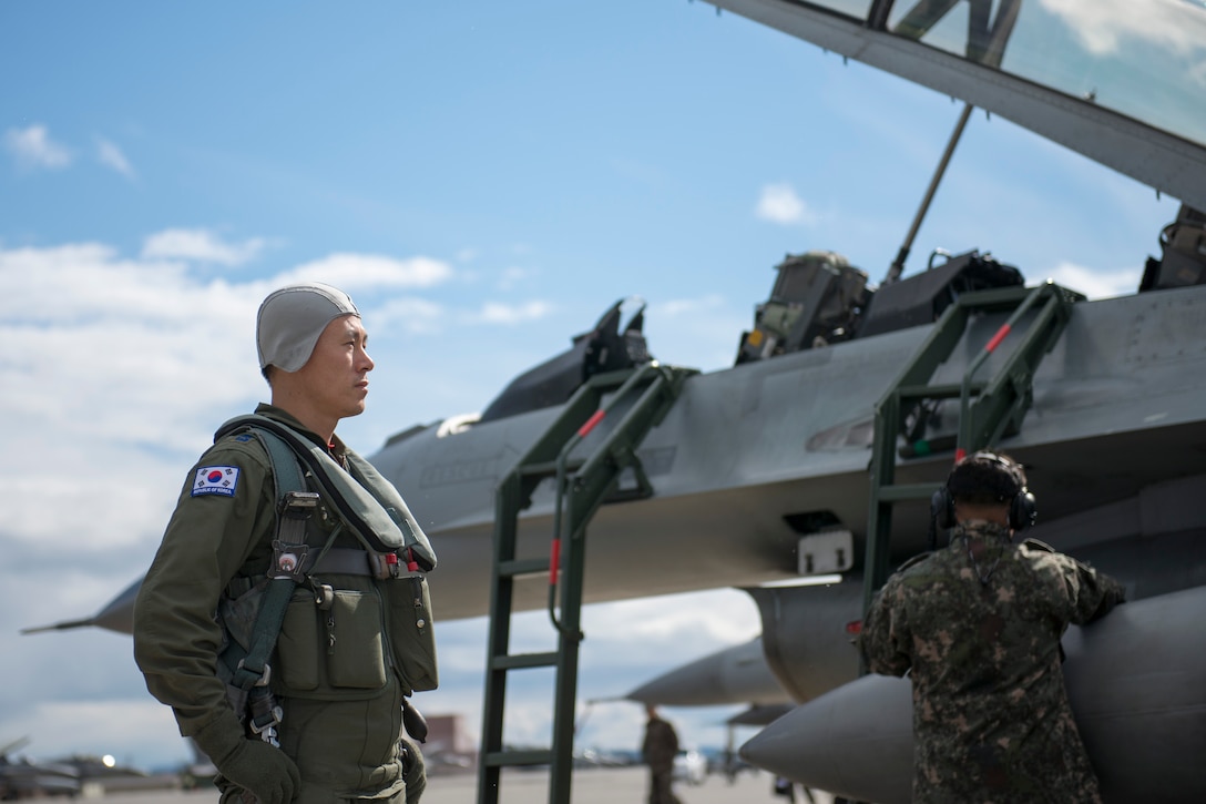 Republic of Korea Air Force (ROKAF) Maj. Lee Dong Seop, a ROKAF F-16D Fighting Falcon pilot, gathers his focus in front of his aircraft, Aug. 11, 2015, prior to the launch of a RED FLAG-Alaska (RF-A) 15-3 sortie from Eielson Air Force Base, Alaska. The ROKAF flew a squadron of F-16Ds across the Pacific Ocean to train in the Joint Pacific Alaska Range Complex’s 67,000 square miles of airspace for two weeks of realistic combat flying training throughout RF-A 15-3. (U.S. Air Force photo by 1st Lt. Elias Zani/Released)