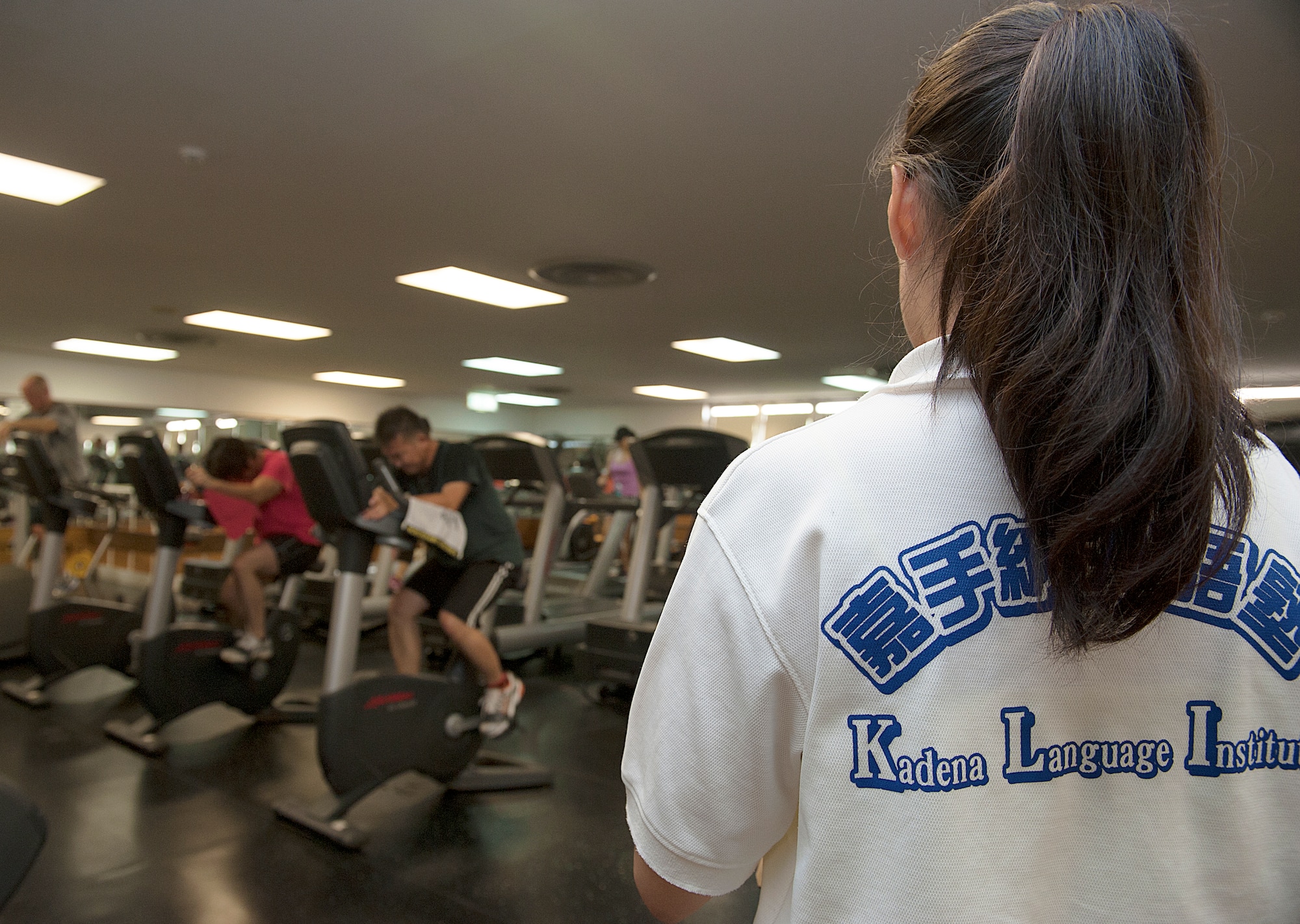 Noriko Nakagawa, Kadena Language Institute student, performs a head count at the Risner Fitness Center on Kadena Air Base, Japan, Aug. 21, 2015. Nakagawa is participating in an internship program which was established 16 years ago and created to help second-year students of KLI gain confidence and increase proficiency in their English communication skills in an American work environment. (U.S. Air Force photo by Naoto Anazawa)

