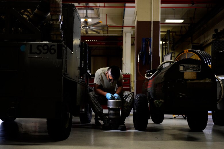 Airman 1st Class Michael Tallada, aerospace ground equipment apprentice and Guam native assigned to the 36th Maintenance Squadron, installs safety wire on a generator part Aug. 12, 2015, at Andersen Air Force Base, Guam. The AGE maintainers care for a variety of essential equipment used during aircraft maintenance and preflight operations. (U.S. Air Force photo by Staff Sgt. Alexander W. Riedel/Released)  