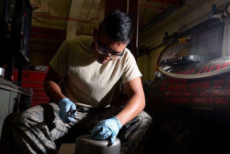 Airman 1st Class Michael Tallada, aerospace ground equipment apprentice and Guam native assigned to the 36th Maintenance Squadron, installs safety wire on a generator part Aug. 12, 2015, at Andersen Air Force Base, Guam. The AGE maintainers care for a variety of essential equipment used during aircraft maintenance and preflight operations. (U.S. Air Force photo by Staff Sgt. Alexander W. Riedel/Released)  