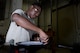 Senior Airman Antonio Simon, aerospace ground equipment journeyman and deployed member of the 36th Maintenance Squadron, installs an improvised rubber seal to a towable jet fuel container Aug. 12, 2015, at Andersen Air Force Base, Guam.  The AGE maintainers care for a variety of essential equipment used during aircraft maintenance and preflight operations. (U.S. Air Force photo by Staff Sgt. Alexander W. Riedel/Released)  