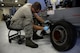 Senior Airman David Rippberger, aerospace ground equipment journeyman and deployed member of the 36th Maintenance Squadron, cleans brake pads on a towable air compressor Aug. 12, 2015, at Andersen Air Force Base, Guam. The maintainers regularly test brake parts for corrosion to ensure safety. (U.S. Air Force photo by Staff Sgt. Alexander W. Riedel/Released)  